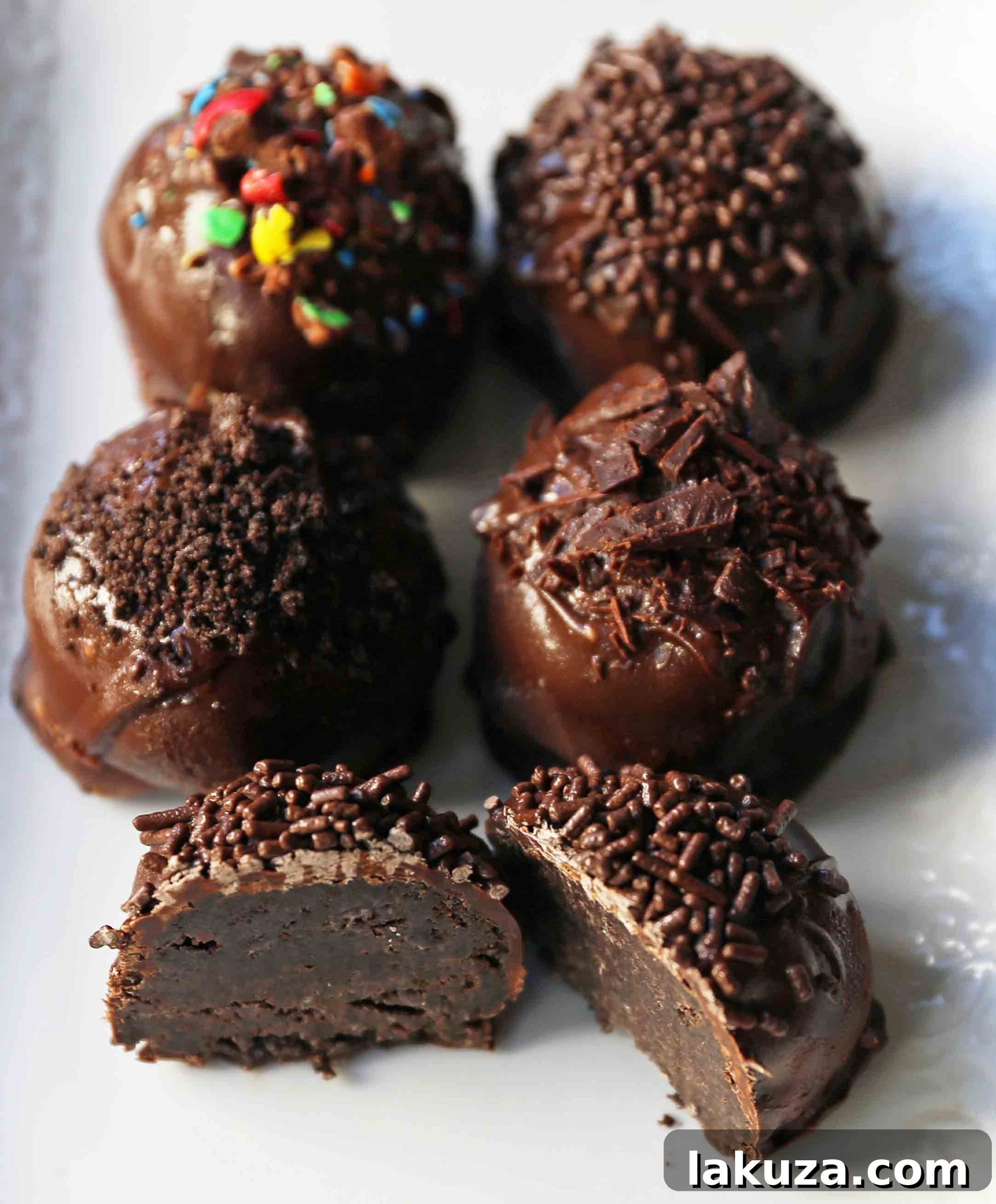 Creamy Oreo Bliss 8 Final plated Oreo truffles with chocolate coating and sprinkles, ready to enjoy.