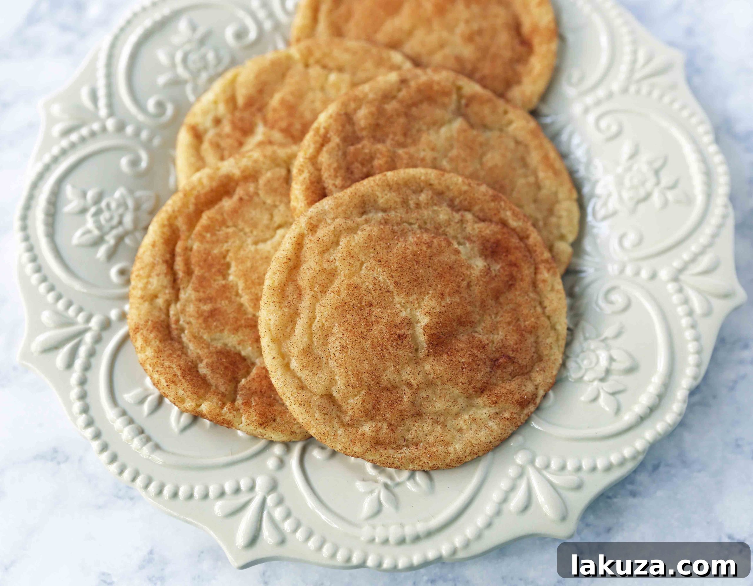 The Best Snickerdoodle Cookie Recipe. Soft and Chewy Snickerdoodle Cookies. The popular cinnamon-sugar soft and chewy sugar cookie recipe. A recipe that has been in the family for over 30 years! #snickerdoodle #snickerdoodles #snickerdoodlecookies #snickerdoodlecookie #cookie #cookies #christmascookies #christmascookies www.modernhoney.com