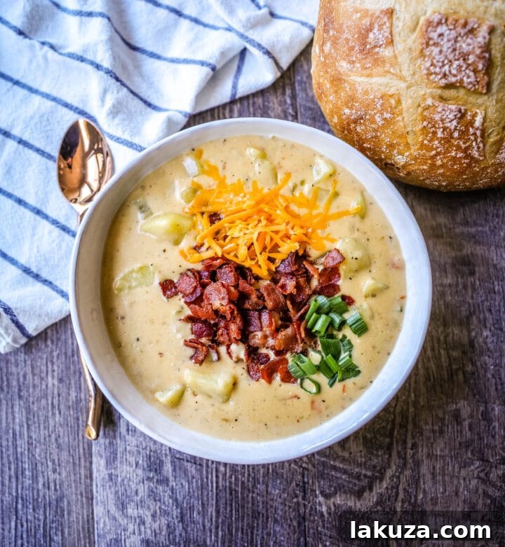 Loaded Baked Potato Soup 2 The Best Baked Potato Soup Recipe. This Potato Cheese Soup is the perfect potato soup topped with crispy bacon, cheddar cheese, and green onions.