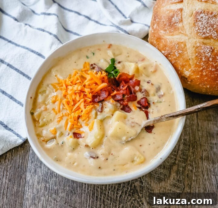 Loaded Baked Potato Soup 3 Loaded Baked Potato Soup is a rich and creamy potato cheese soup topped with crispy bacon, sour cream, green onions, and sharp cheddar cheese. A family favorite potato cheese soup recipe!