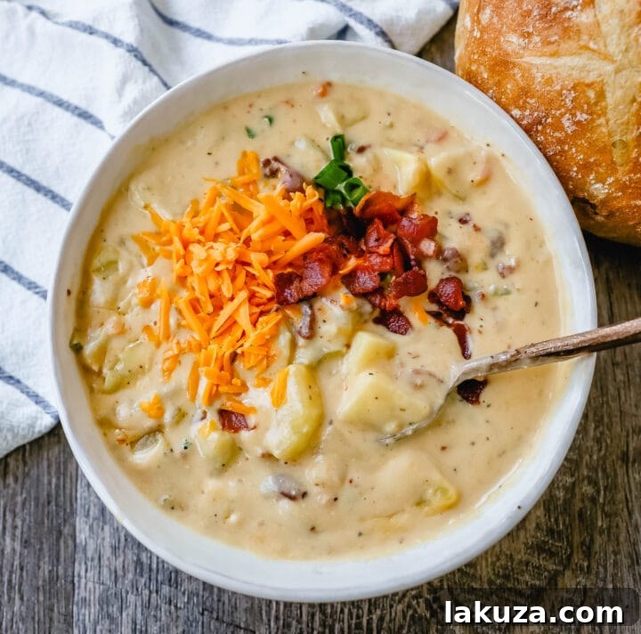 Loaded Baked Potato Soup 4 Loaded Baked Potato Soup is a rich and creamy potato cheese soup topped with crispy bacon, sour cream, green onions, and sharp cheddar cheese. A family favorite potato cheese soup recipe!