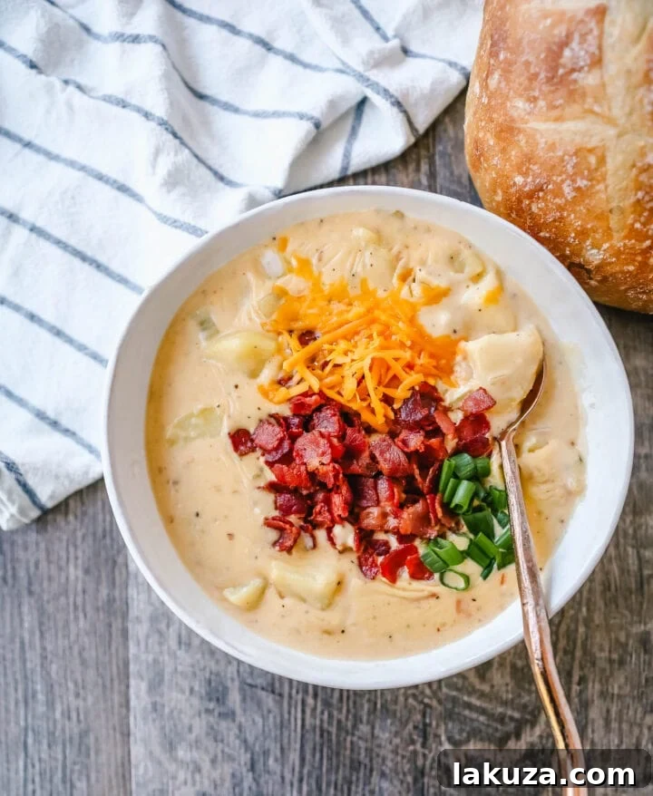 Loaded Baked Potato Soup 5 Loaded Baked Potato Soup is a rich and creamy potato cheese soup topped with crispy bacon, sour cream, green onions, and sharp cheddar cheese. A family favorite potato cheese soup recipe!