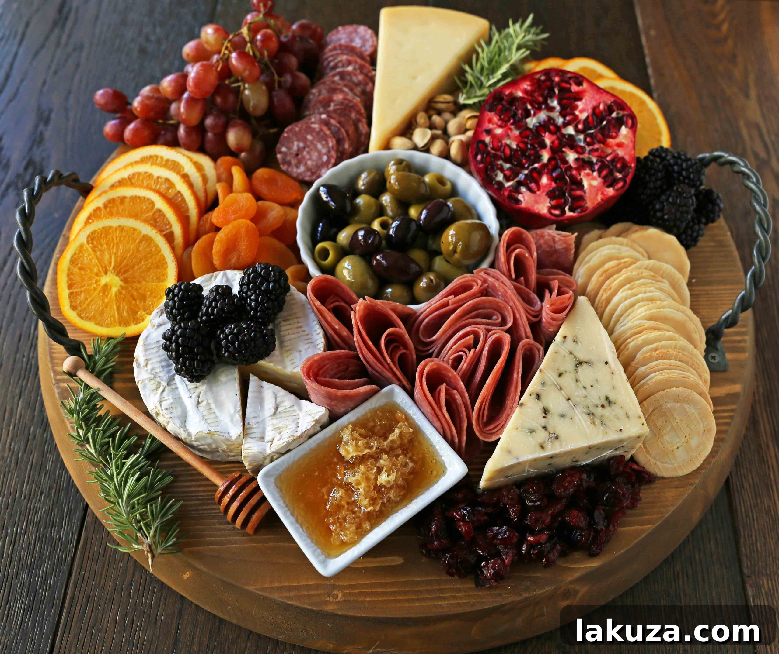 Winter charcuterie board featuring a vibrant selection of seasonal fruits like pomegranates, figs, and citrus, alongside premium cheeses and meats.