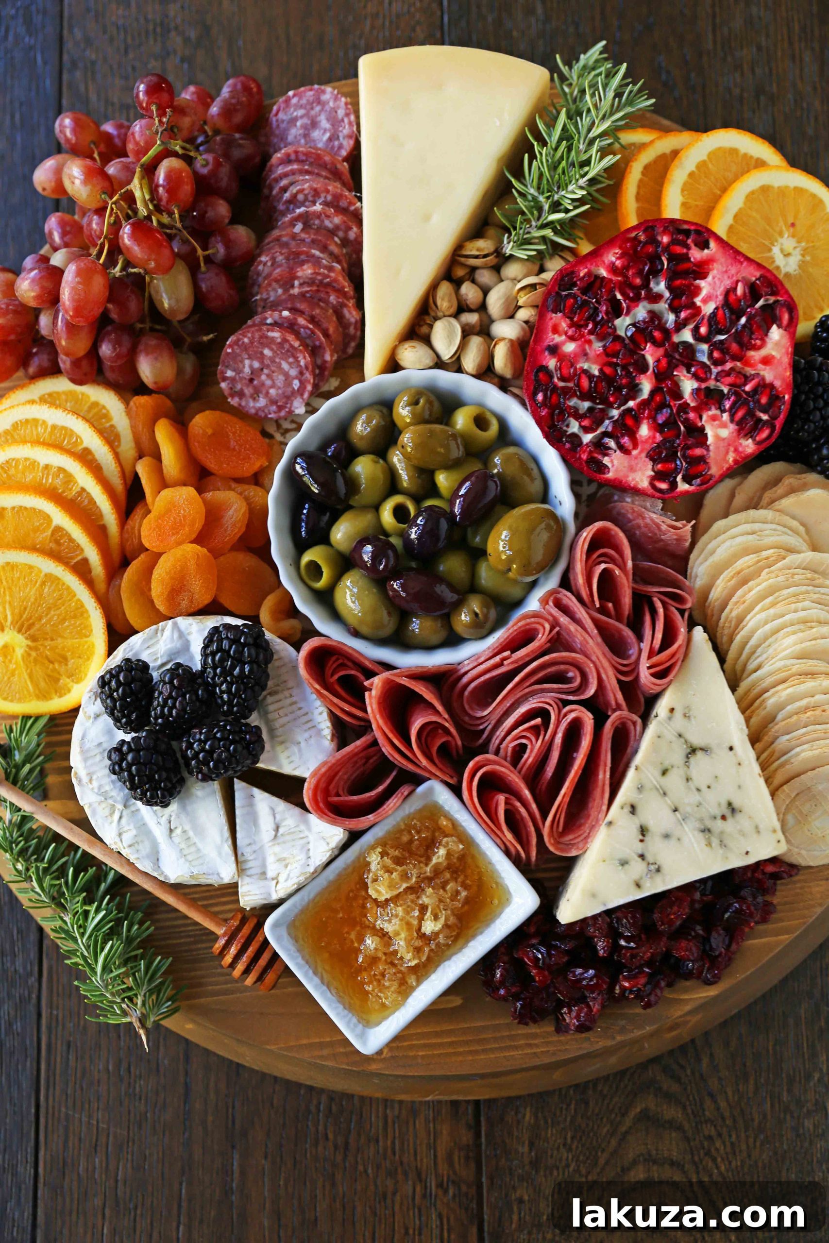 A beautifully assembled charcuterie board featuring a variety of cured meats, gourmet cheeses, olives, honey, and crackers, perfect for entertaining.