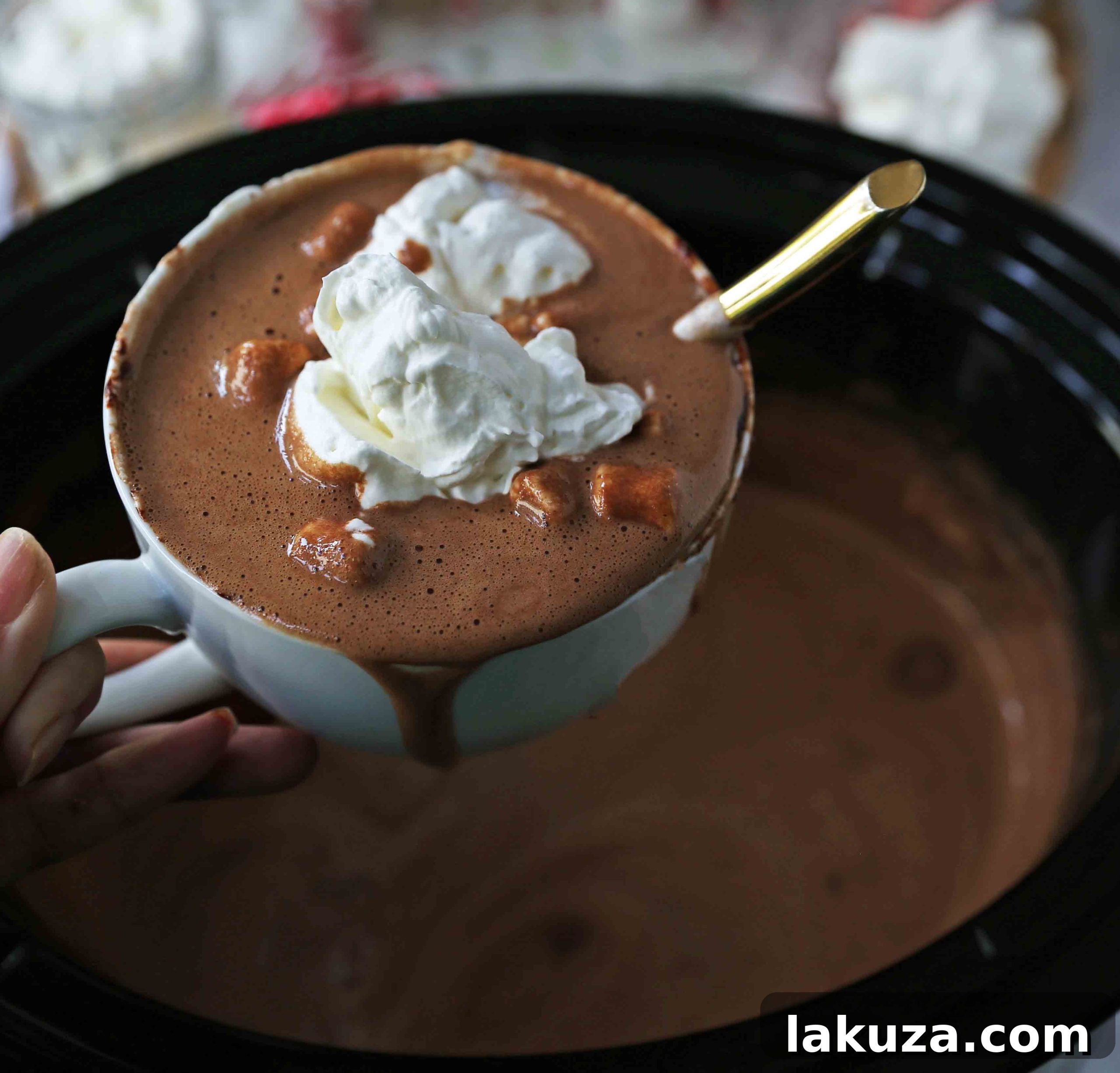 Homemade Hot Chocolate Recipe. How to make easy 5-ingredient gourmet hot chocolate. This Slow Cooker Hot Chocolate is perfect to serve at parties. A list of hot chocolate toppings ideas to make your very own Hot Chocolate Bar. www.modernhoney.com #hotchocolate #homemadehotchocolate #chocolate #hotchocolatebar #hotchocolatetoppings #christmas