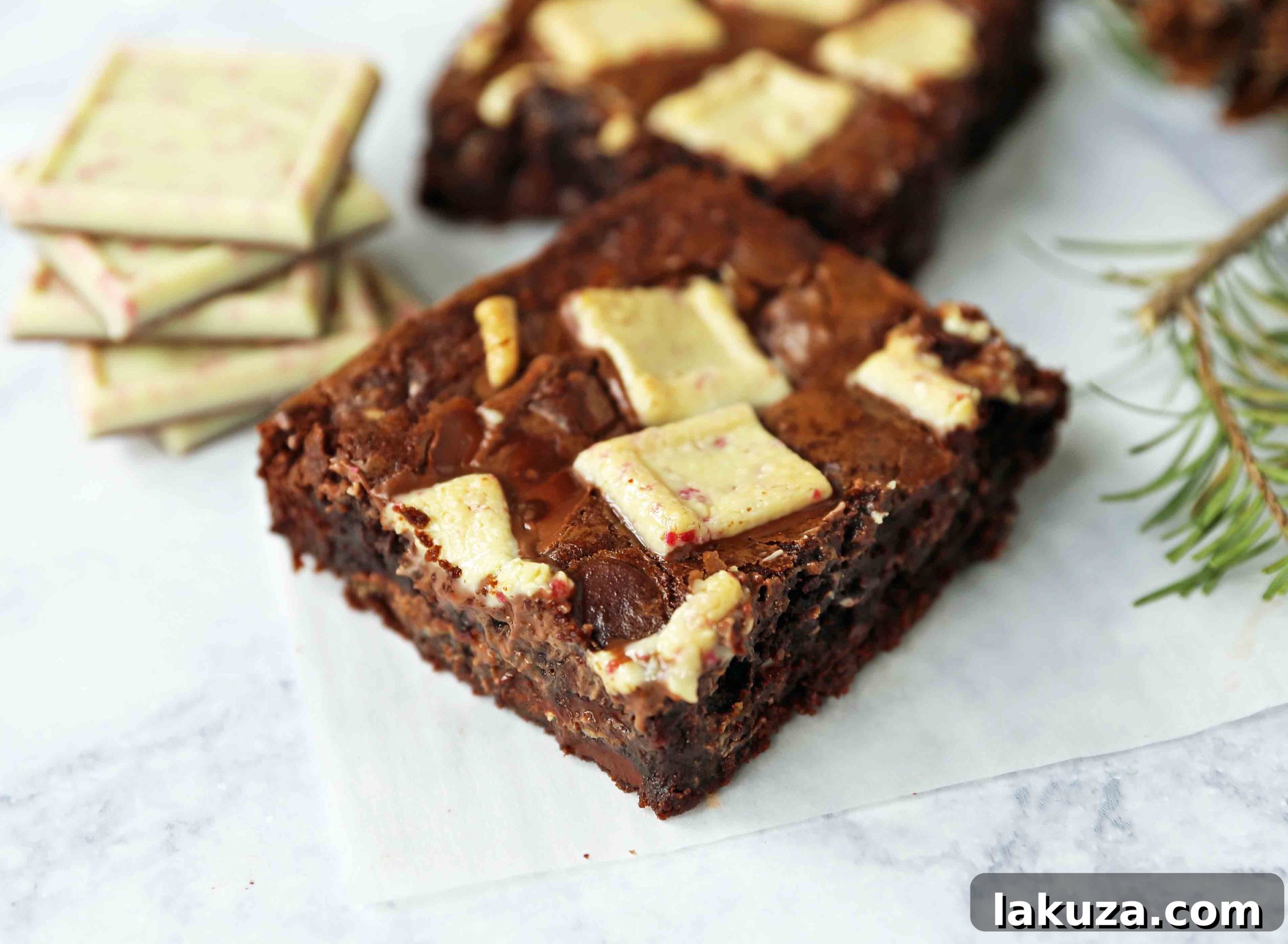 Close-up of freshly baked Peppermint Bark Brownies with melted peppermint pieces on top, showcasing their festive appeal