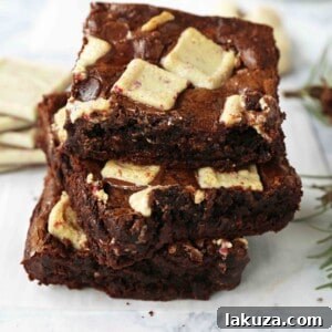 Peppermint Bark Chocolate Brownies. Decadent homemade chocolate brownies with white chocolate peppermint bark. The perfect Christmas holiday brownie.