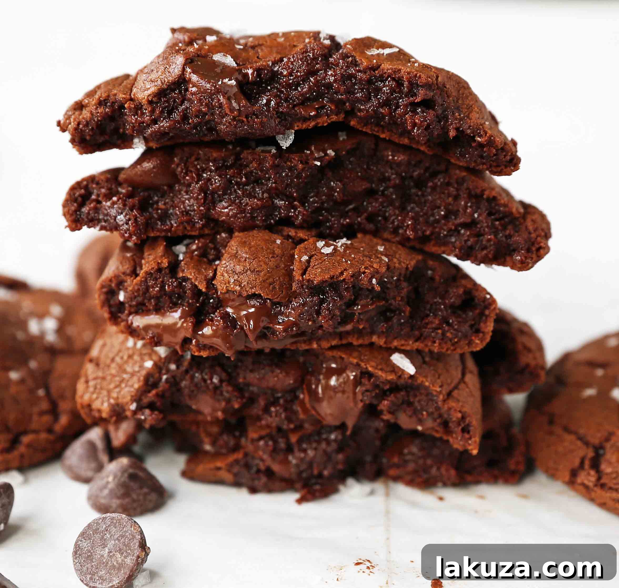 Decadent Chocolate Brownie Cookies 3 Close-up of freshly baked chocolate brownie cookies with melted chocolate chips, showcasing their rich color and inviting texture.