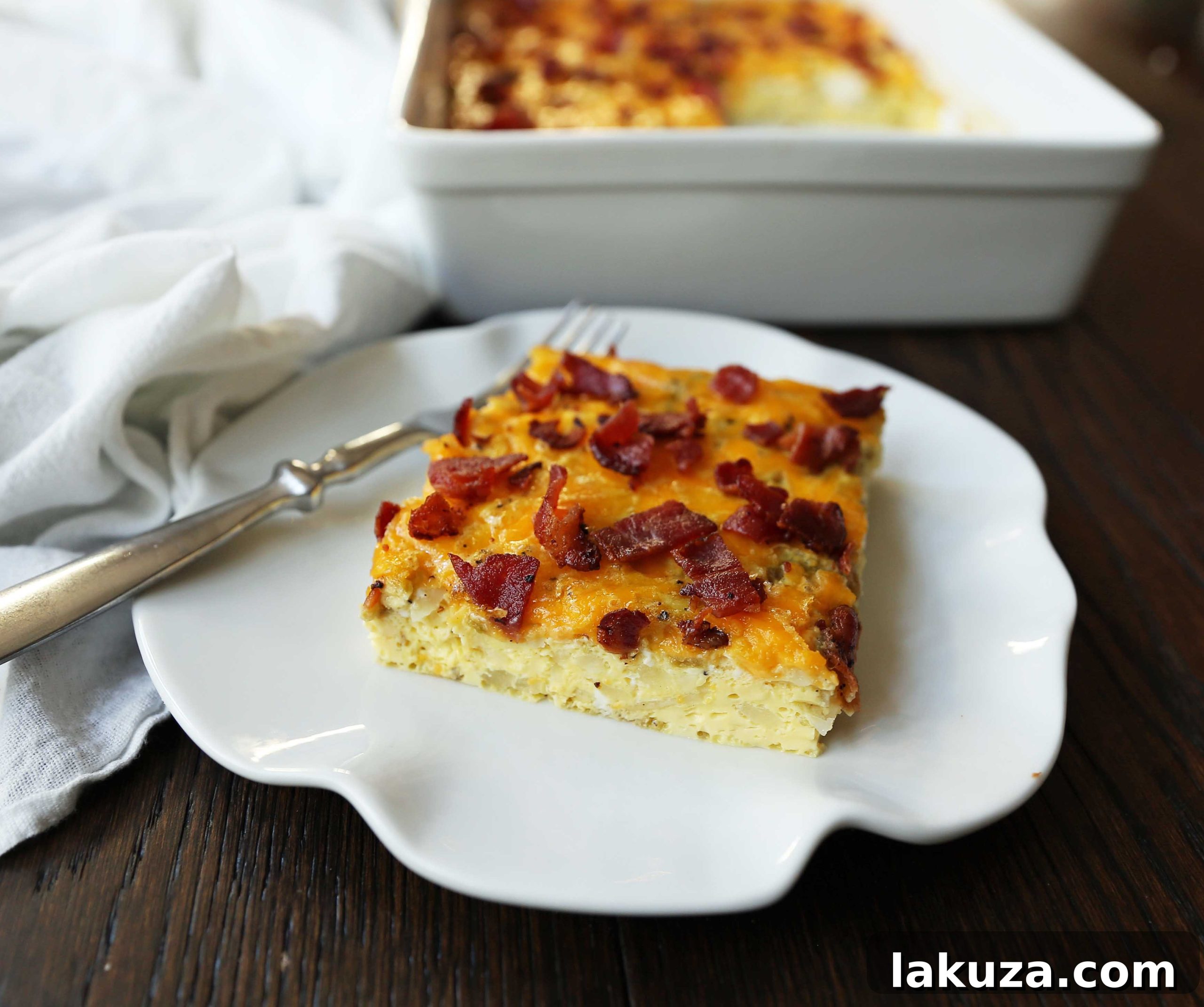 Savory Breakfast Bake 3 Easy Bacon Egg and Cheese Casserole. Perfect for Christmas breakfast or any special occasion. A delicious blend of green chilies, cream cheese, crispy bacon, and sharp cheddar. Simple and satisfying.