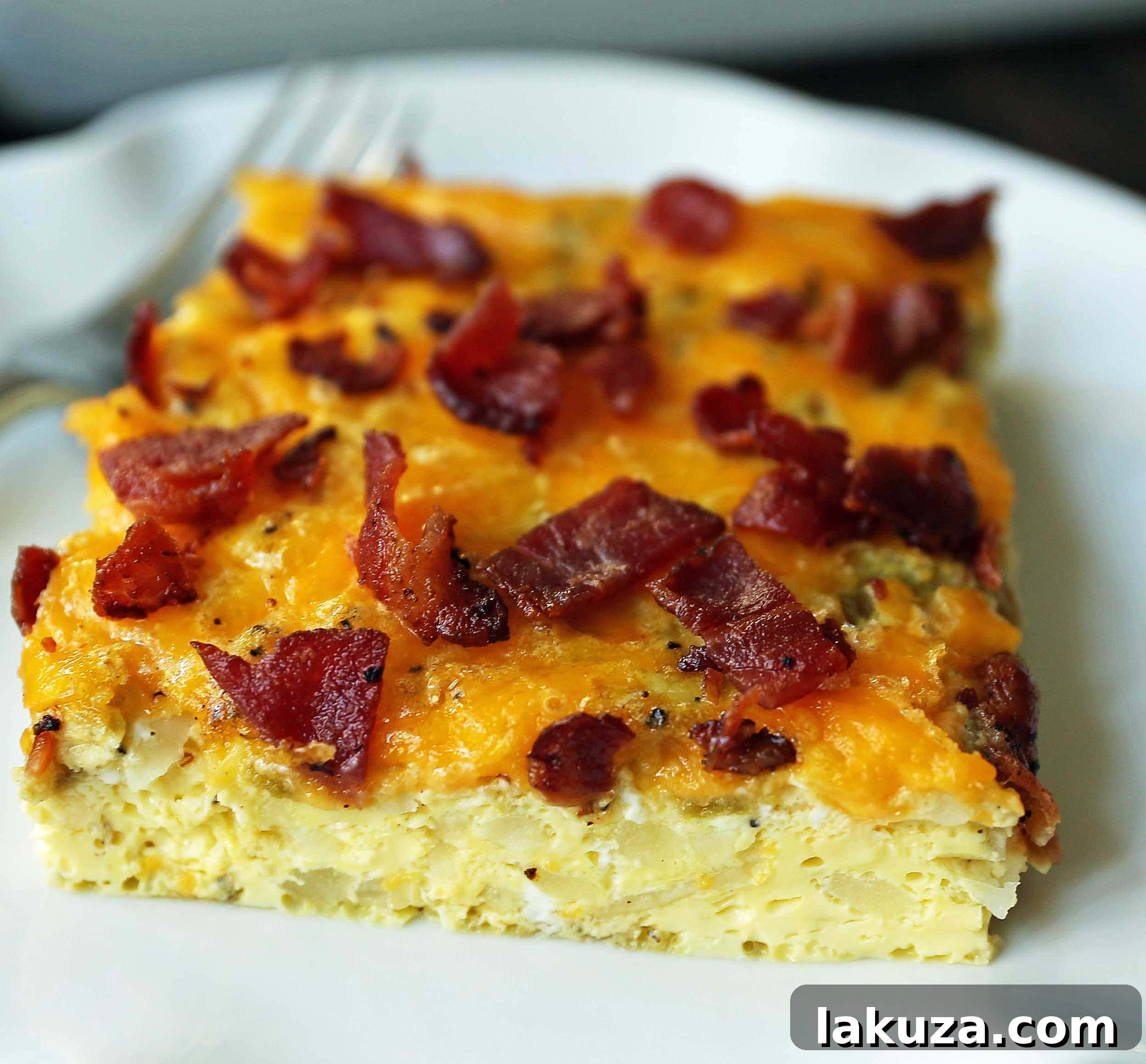 Savory Breakfast Bake 4 Delicious Bacon Egg and Cheese Breakfast Casserole. Featuring creamy elements and a blend of savory flavors, it's an easy breakfast dish that everyone loves.
