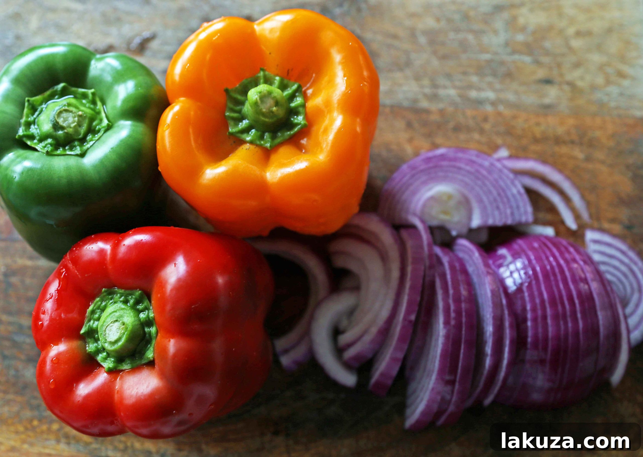 Colorful Bell Peppers and Onions for Fajitas: Fresh, thinly sliced vegetables ready to be sautéed, forming the vibrant base of the best chicken fajitas.