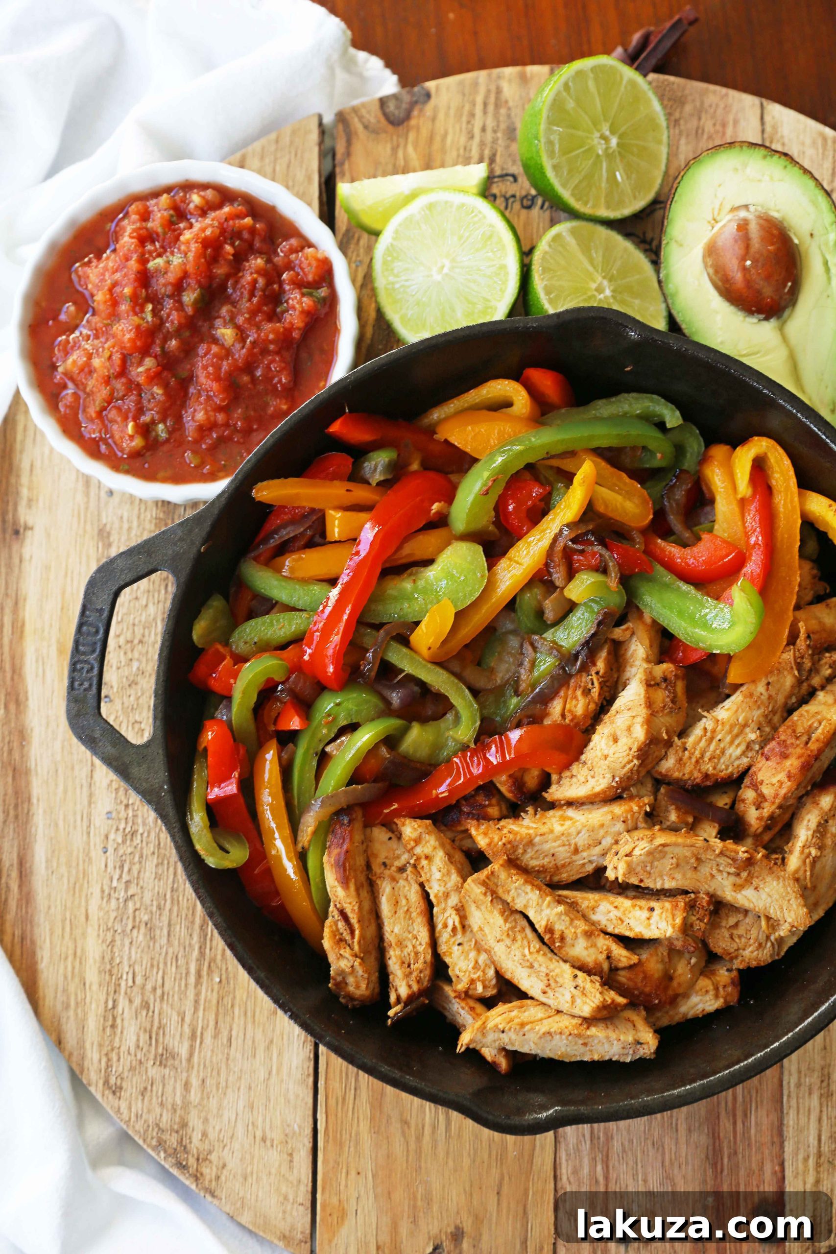 Perfectly Cooked Chicken Fajitas: Tender chicken strips with expertly sautéed onions and peppers, ready to be served with warm tortillas and fresh toppings.
