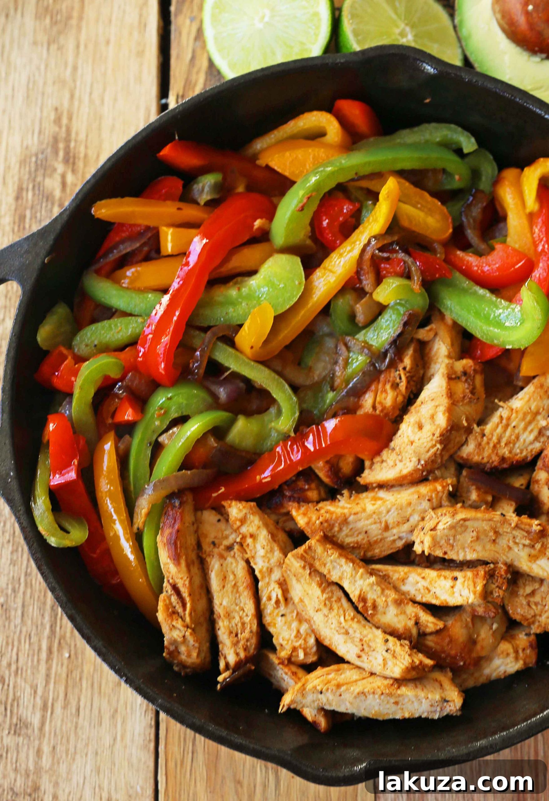 Plated Chicken Fajitas: A close-up of delicious chicken and vegetable fajitas, garnished with fresh cilantro and lime wedges, ready for enjoyment.