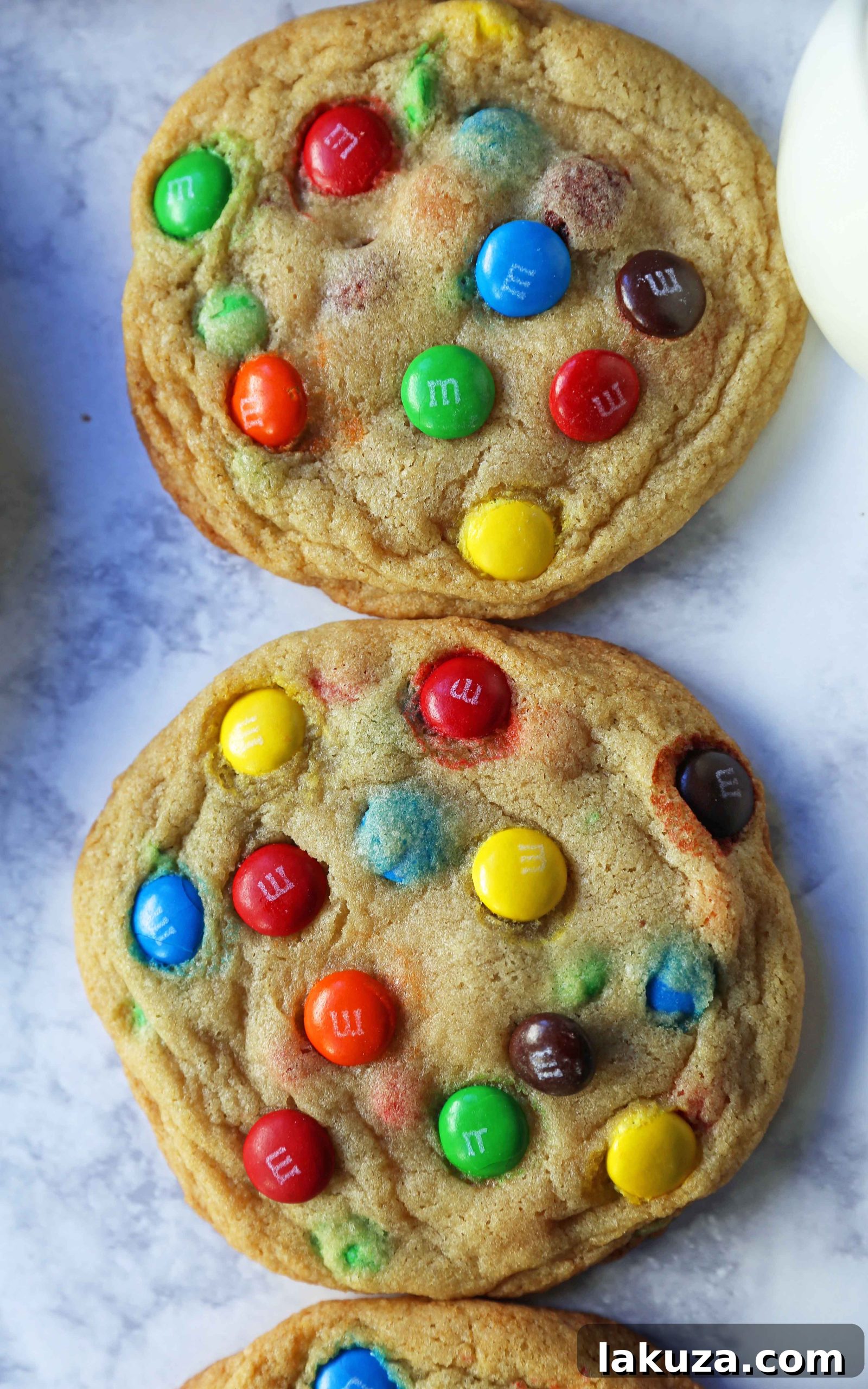 Soft and Chewy M&M Cookies: Freshly baked M&M cookies cooling on a wire rack, ready to be enjoyed.
