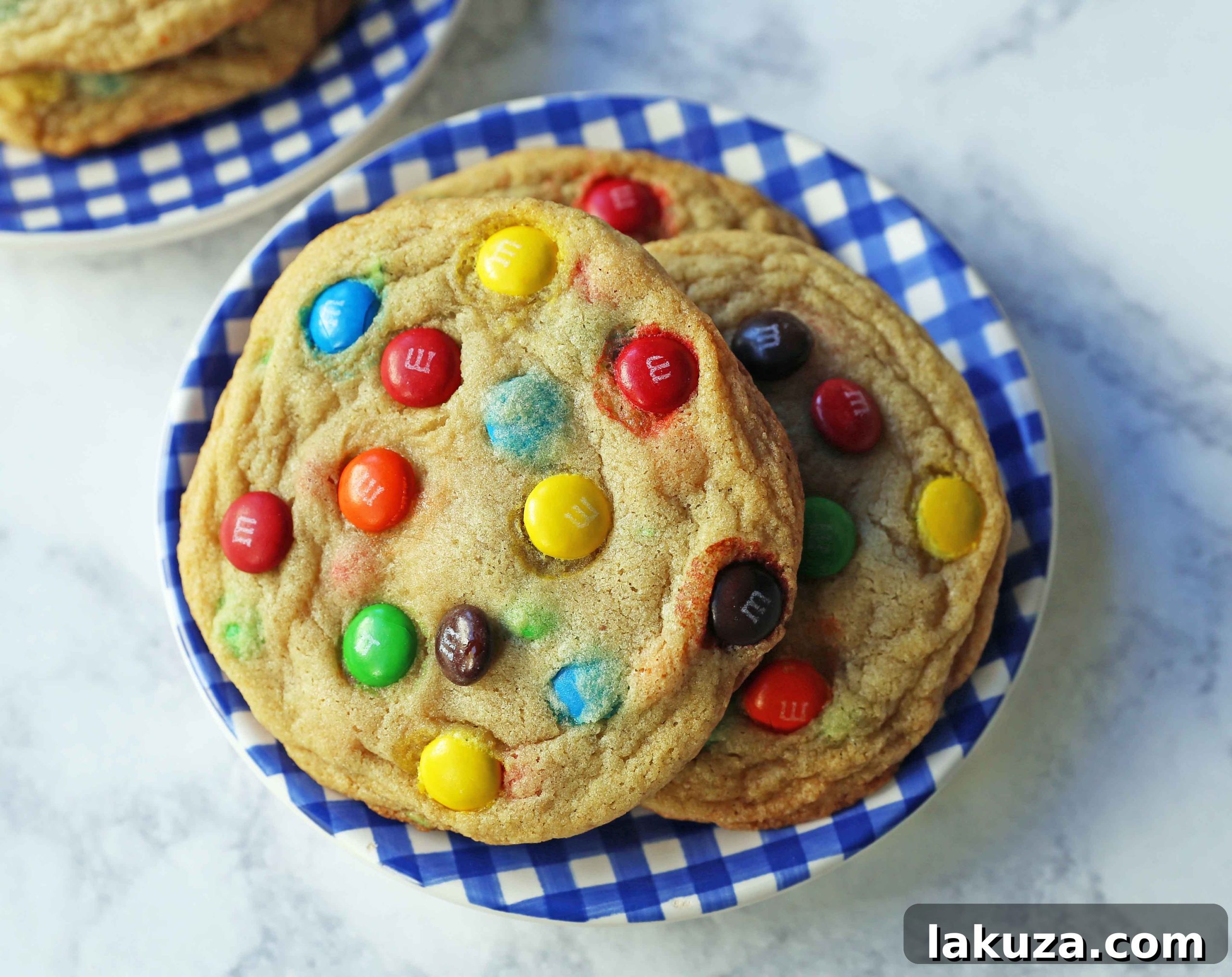 Soft and Chewy M&M Cookies: A perfectly baked M&M cookie, showcasing its soft center and vibrant colors.