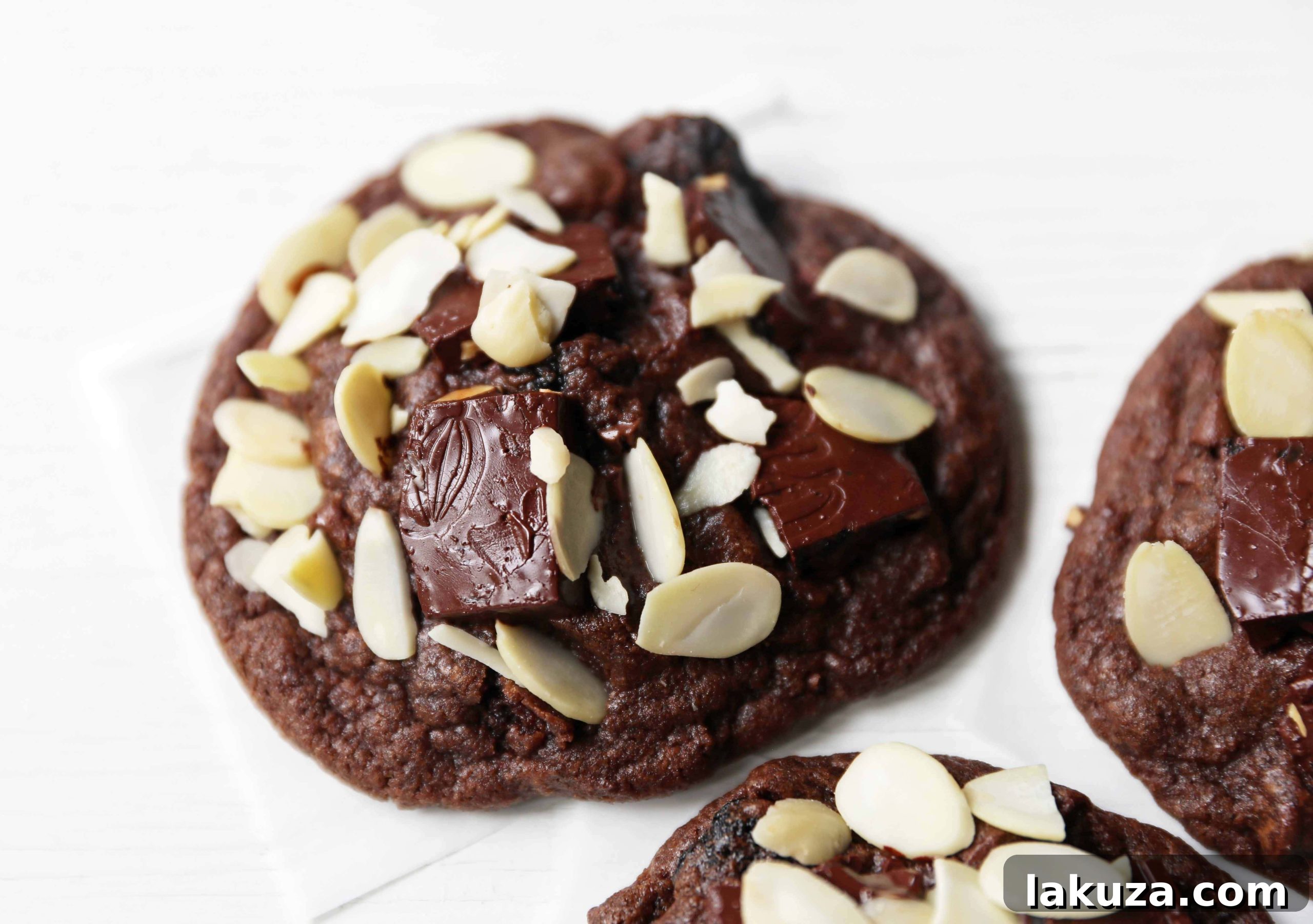 Rich Chocolate Cherry Bliss 3 Warm Chocolate Cherry Almond Cookies cooling on a wire rack, ready to be served