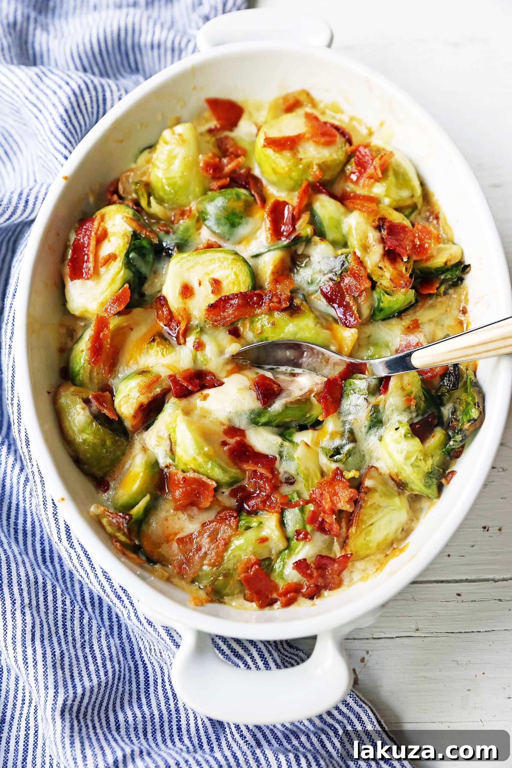 Close-up of creamy cheesy brussels sprouts with bacon, ready to be served.