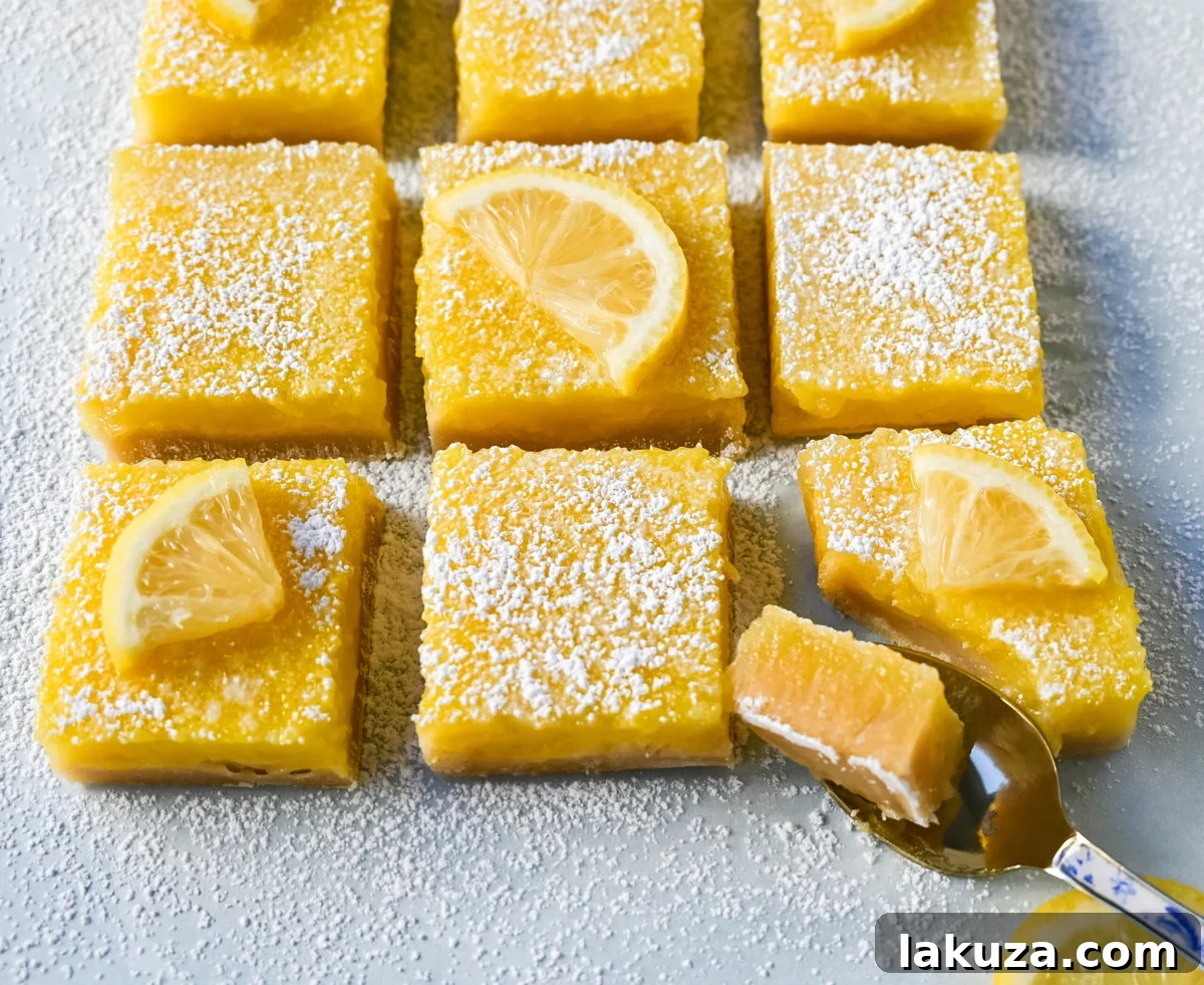 Sunshine Lemon Squares 3 Homemade Lemon Bars cooling on a wire rack, showcasing the golden shortbread and creamy lemon filling. A perfect, zesty dessert.