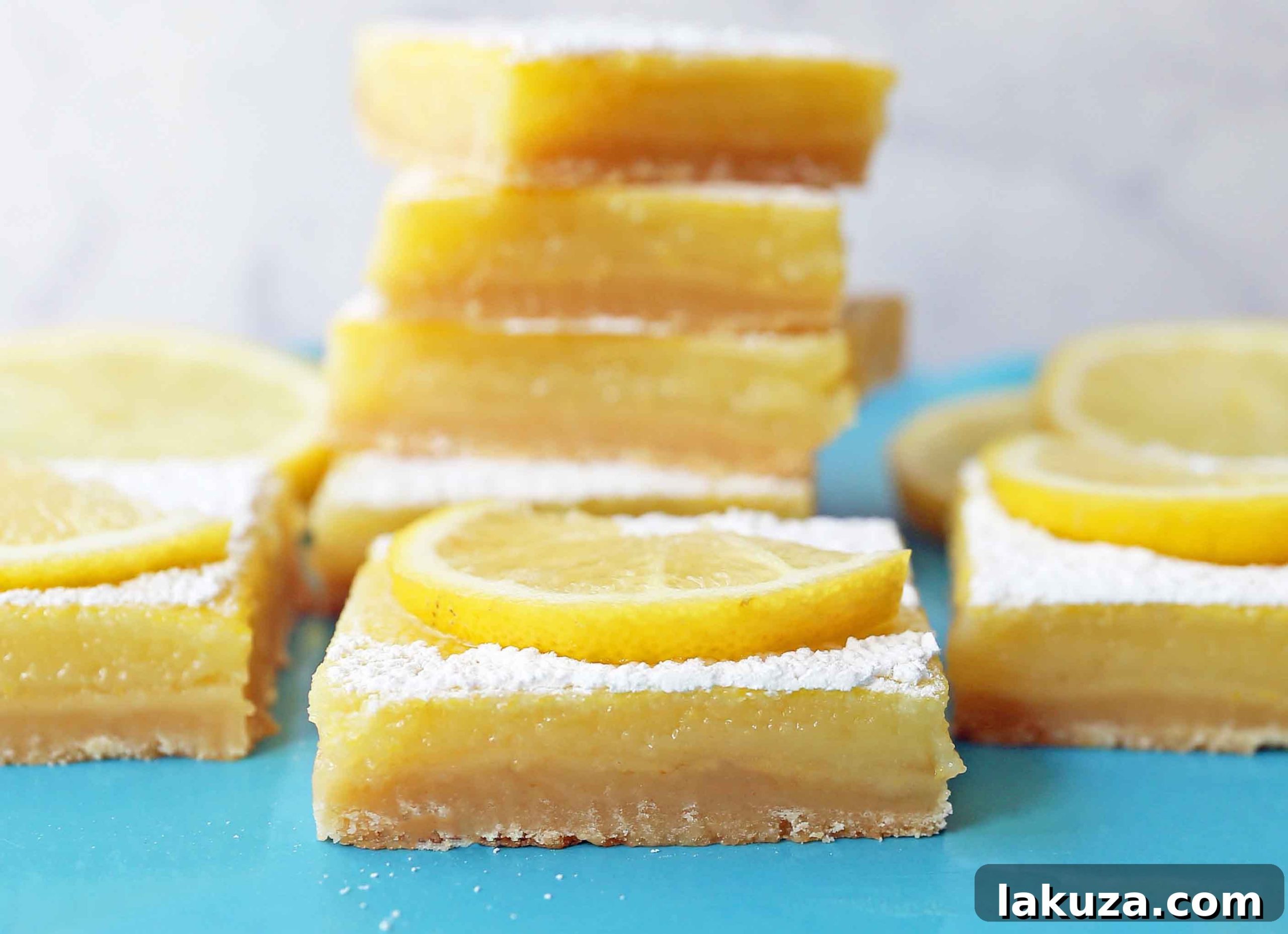 Sunshine Lemon Squares 7 Delicious lemon bars generously dusted with powdered sugar, ready for serving. Highlight perfect cuts and inviting texture.