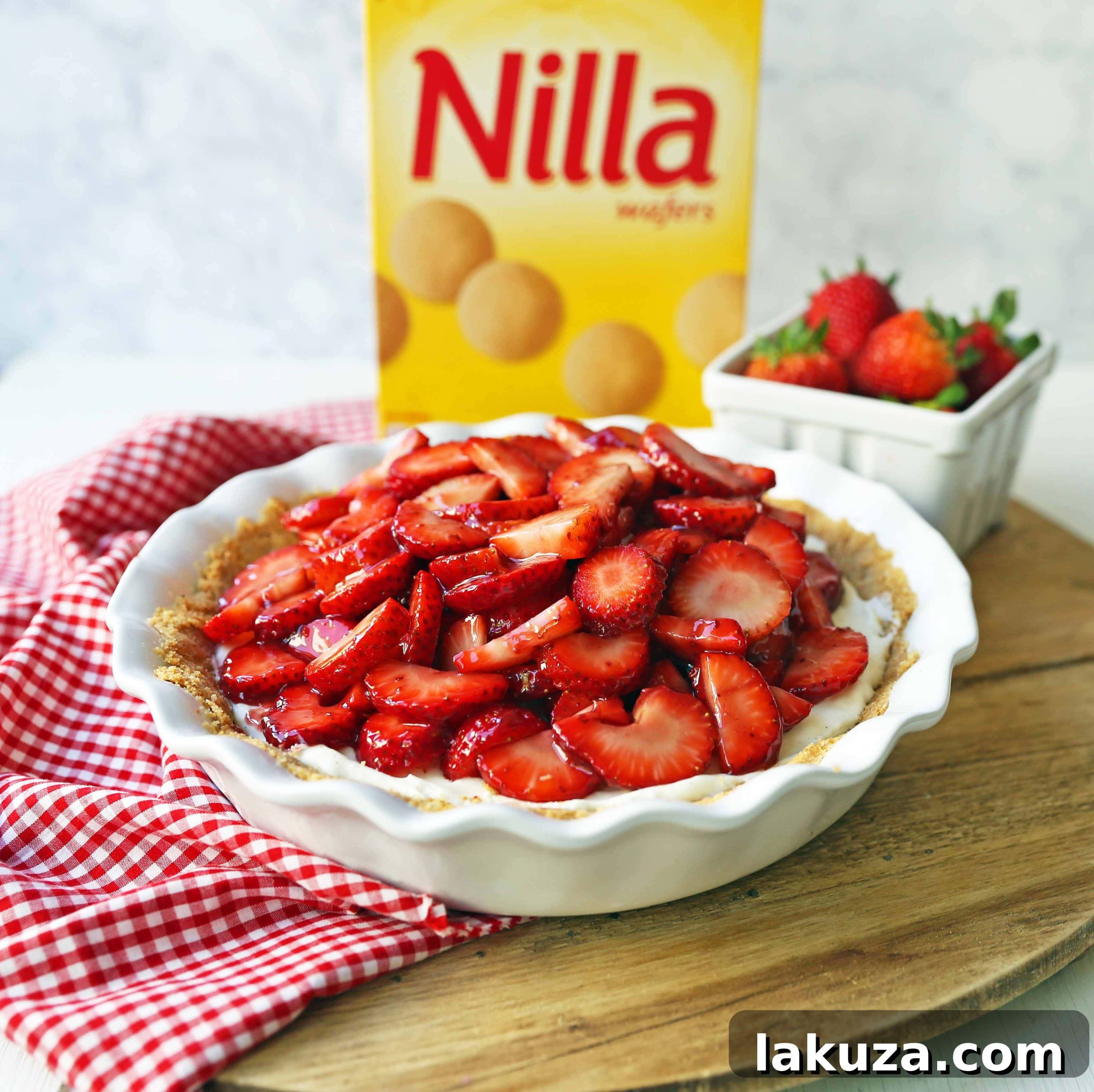 Top-down view of Strawberry Cream Cheese Pie, showing the vibrant red strawberries and creamy white filling.