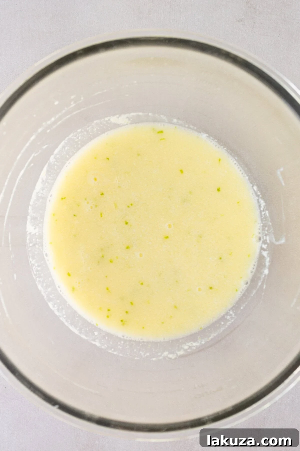 Zesty Key Lime Indulgence 7 Making a homemade key lime cake batter with fresh ingredients.