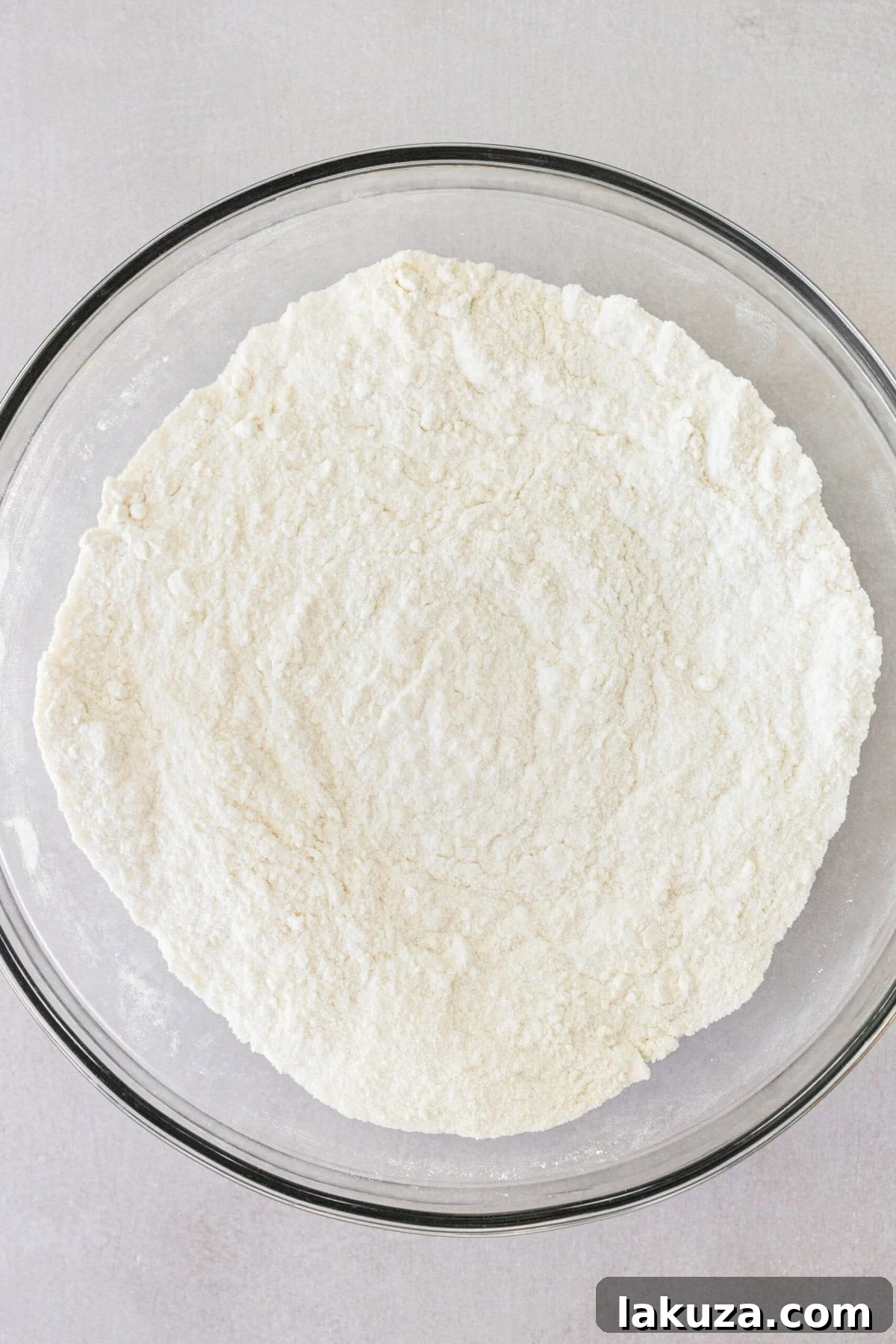 Zesty Key Lime Indulgence 8 Making a homemade key lime cake with dry ingredients in a bowl