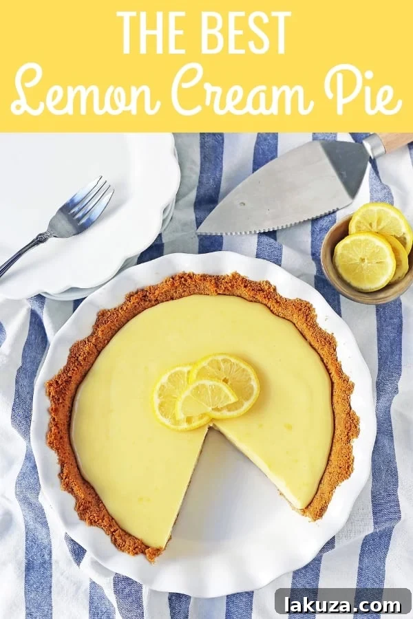 A visually appealing shot of the Lemon Cream Pie, featuring a full view with a beautiful presentation, ready to be sliced and served.