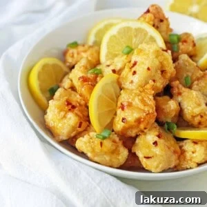 Golden Crispy Lemon Chicken 7 Crispy Chinese Lemon Chicken with a tangy sauce, perfect for a homemade takeout experience.