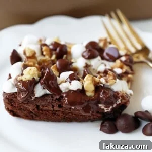 Rocky Road Brownies, a classic homemade dessert with marshmallows, chocolate chips, and walnuts.
