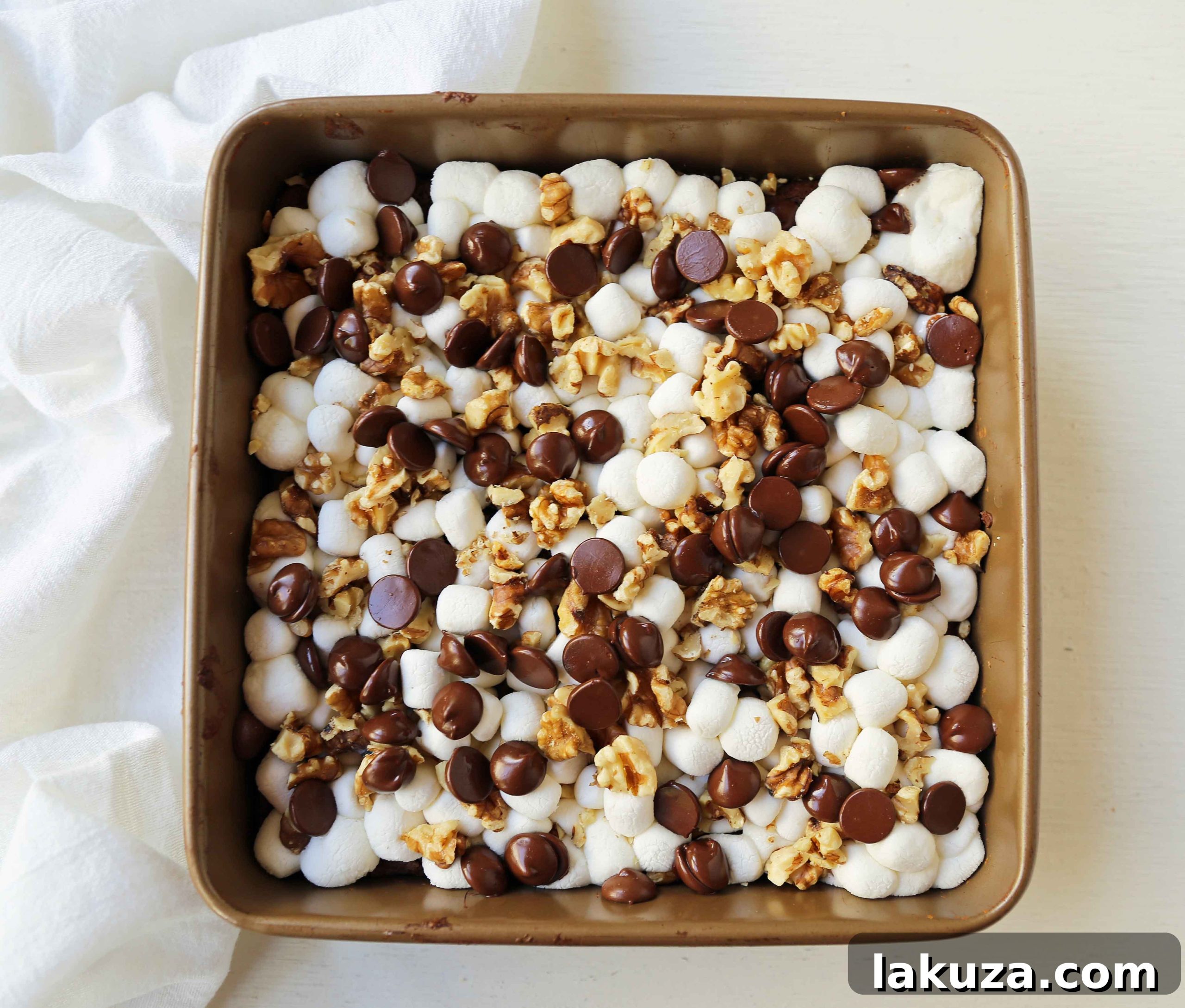 Close-up shot of Rocky Road Brownies with melted marshmallows and chocolate chunks.