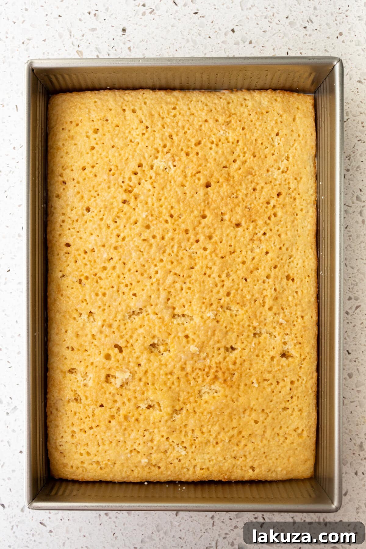 Poke holes in sponge cake for tres leches cake.