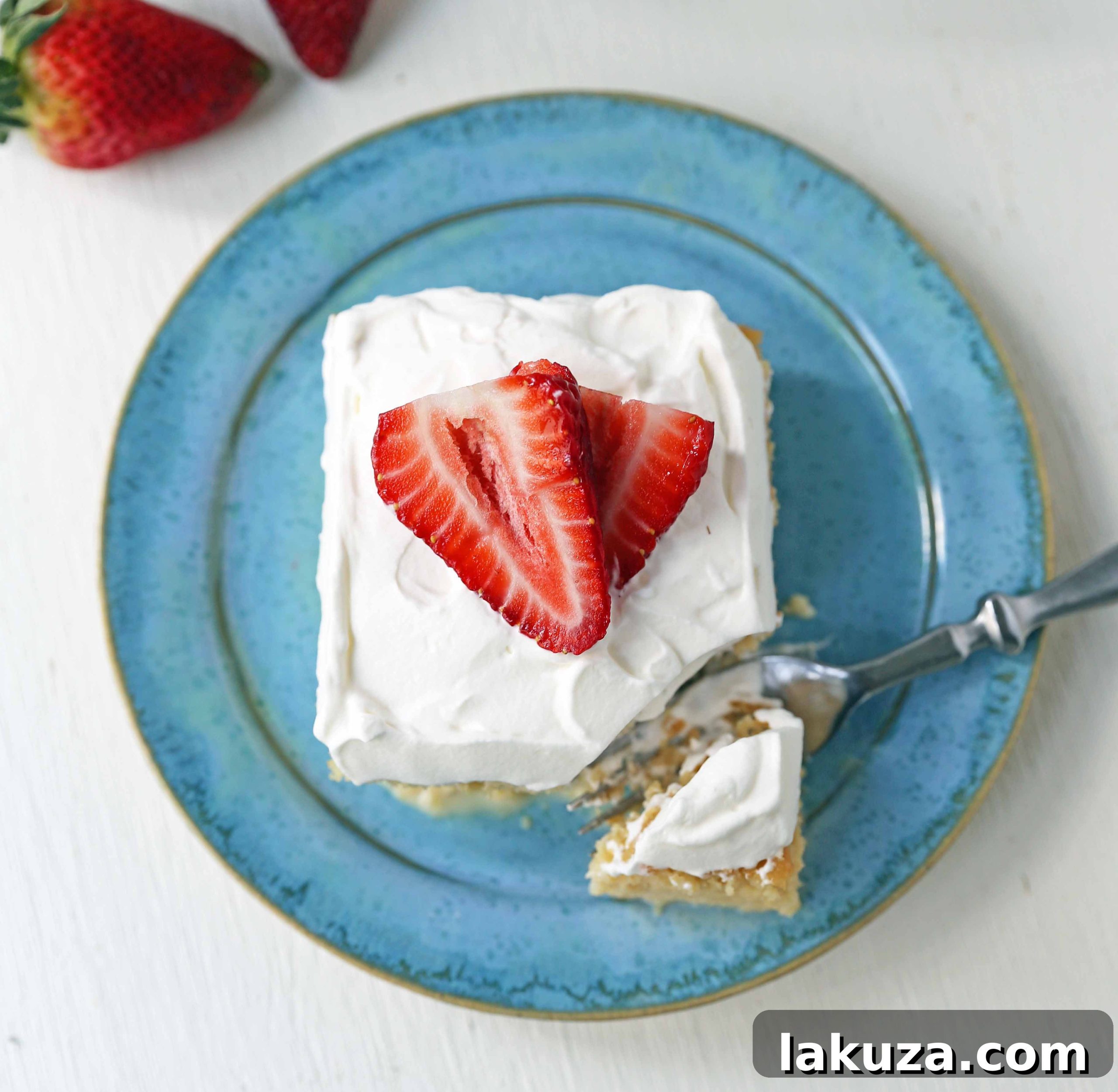 Tres Leches Cake. A classic Mexican dessert made with a vanilla sponge cake soaked with three kinds of milk -- heavy cream, evaporated milk and sweetened condensed milk and topped with whipped cream.  www.modernhoney.com #treslechescake #threemilkcake #cincodemayo