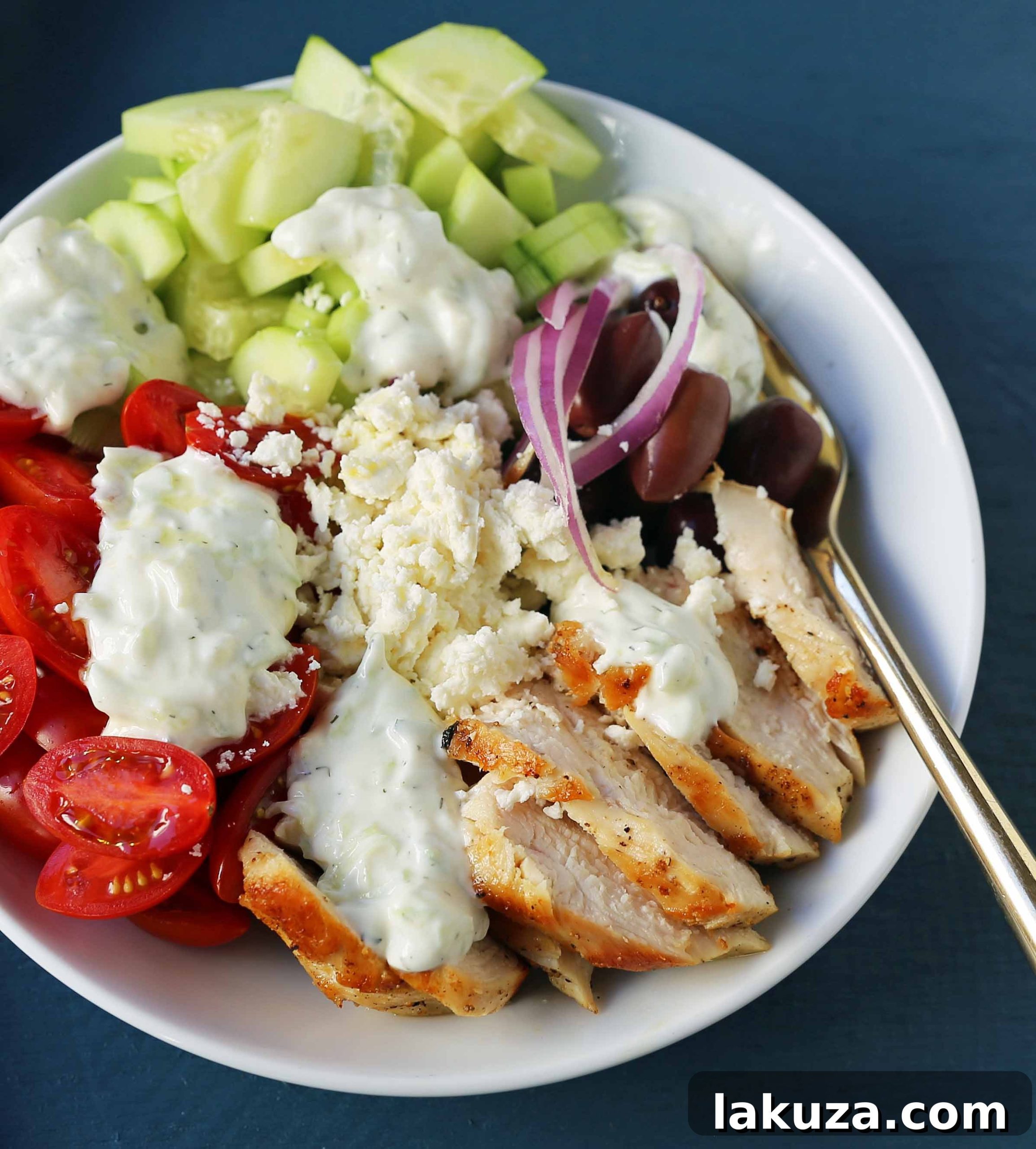 Grecian Harvest Bowls 5 Close-up of a vibrant Greek Chicken Bowl, highlighting fresh ingredients and rich textures. A perfect example of healthy meal prepping.
