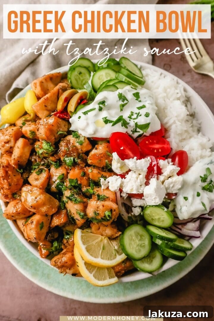 Grecian Harvest Bowls 7 A beautifully plated Greek Chicken Bowl, ready to be enjoyed. Highlights the fresh ingredients and appealing presentation of the dish.