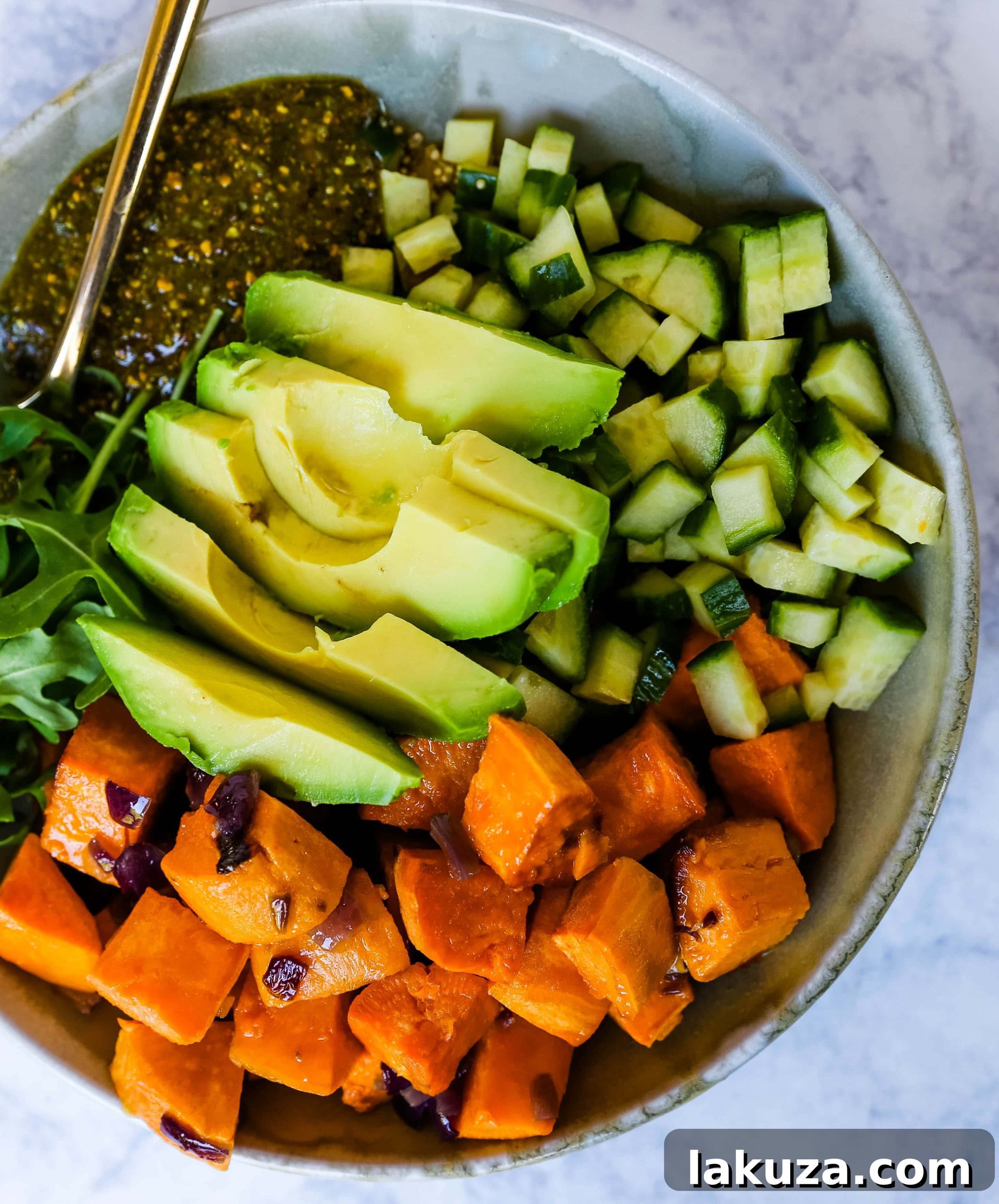 Vibrant Pistachio Pesto Power Bowl 4 Healthy ingredients for a Buddha Bowl: roasted sweet potatoes and onions ready to be assembled, demonstrating the meal prep friendly nature of the dish.