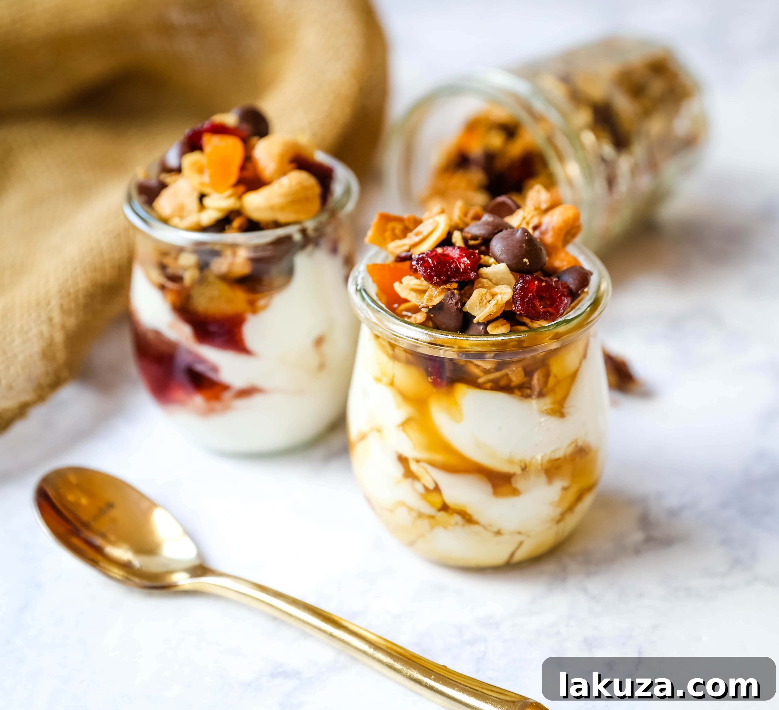 Tropical Chocolate Coconut Crunch 5 Serving homemade Chocolate Coconut Granola in a bowl with yogurt and fresh fruit