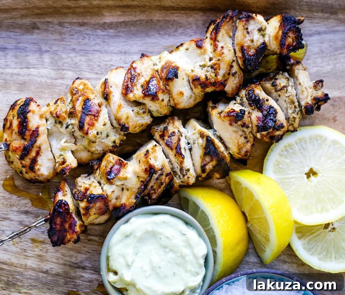 Zesty Greek Chicken Skewers 3 Greek Chicken Kabobs Yogurt marinated and Greek spiced chicken grilled to perfection and dipped in homemade tzatziki sauce.