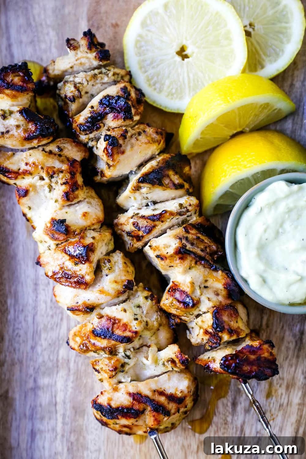 Zesty Greek Chicken Skewers 4 Greek Chicken Kabobs Yogurt marinated and Greek spiced chicken grilled to perfection and dipped in homemade tzatziki sauce.