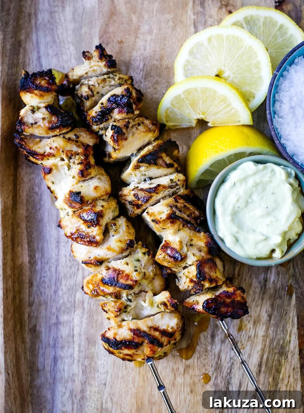 Zesty Greek Chicken Skewers 5 Greek Chicken Kabobs Yogurt marinated and Greek spiced chicken grilled to perfection and dipped in homemade tzatziki sauce.