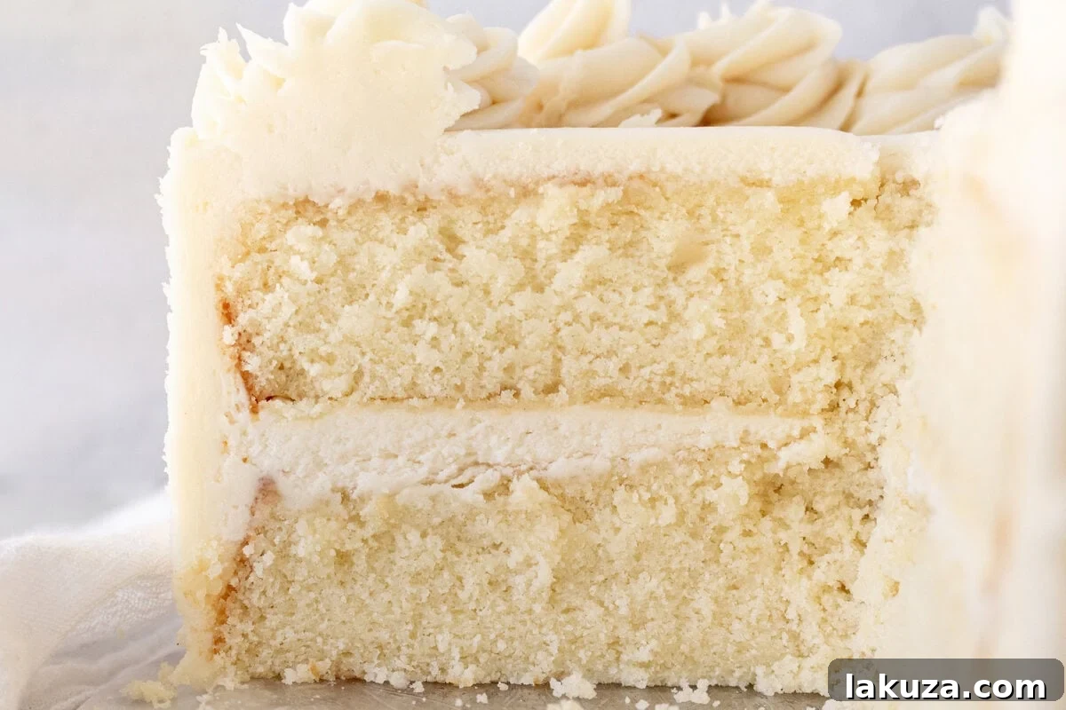 Close-up of baked vanilla cake layers cooling on a wire rack.