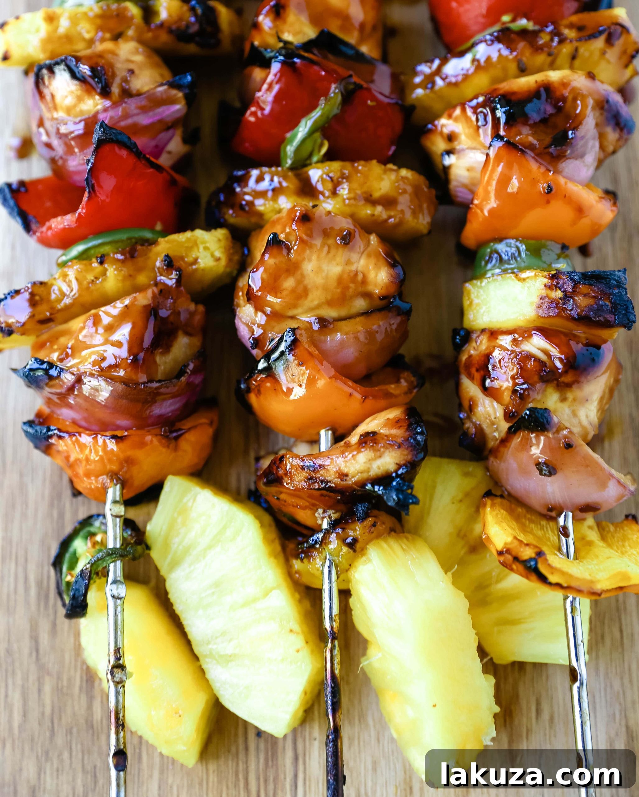 Aloha Teriyaki Chicken Skewers 5 Arrangement of uncooked Hawaiian Teriyaki Chicken Skewers on a tray, ready for grilling, showcasing the colorful ingredients.