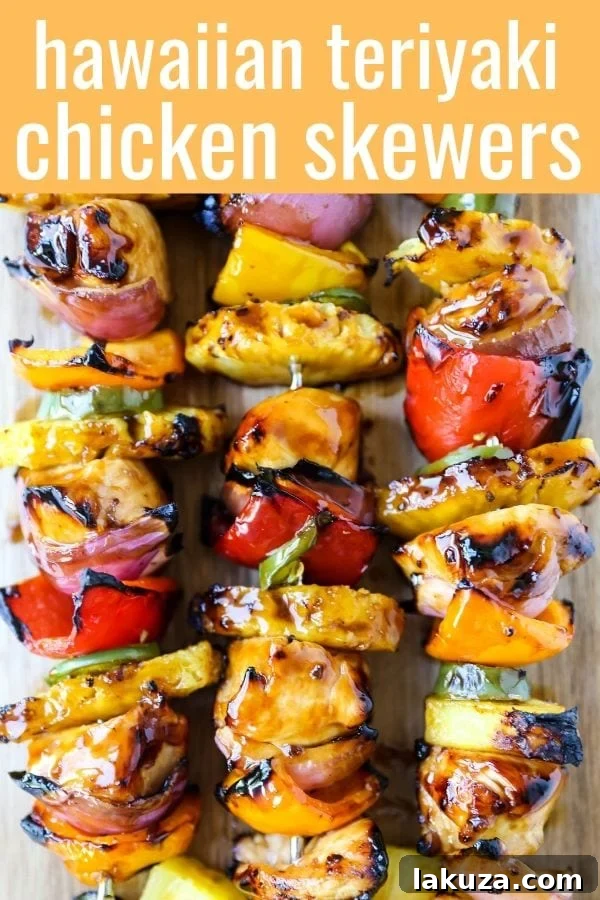 Aloha Teriyaki Chicken Skewers 6 Cooked Hawaiian Teriyaki Chicken Skewers on a serving platter with fresh herbs, showcasing the vibrant colors and appealing texture.