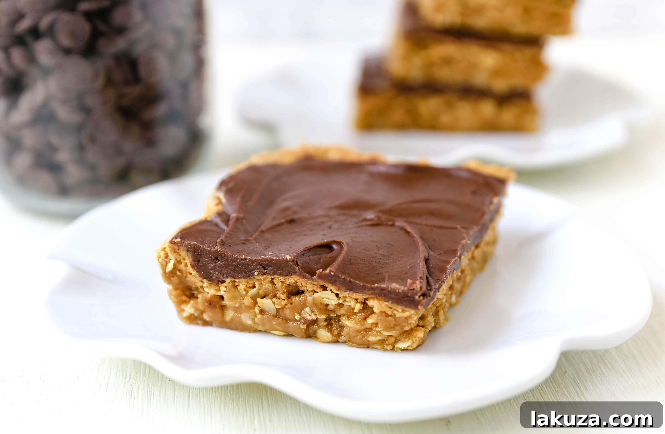 Delicious Chocolate Peanut Butter Cookie Bars with a creamy chocolate frosting, perfect for any peanut butter lover's dream dessert.