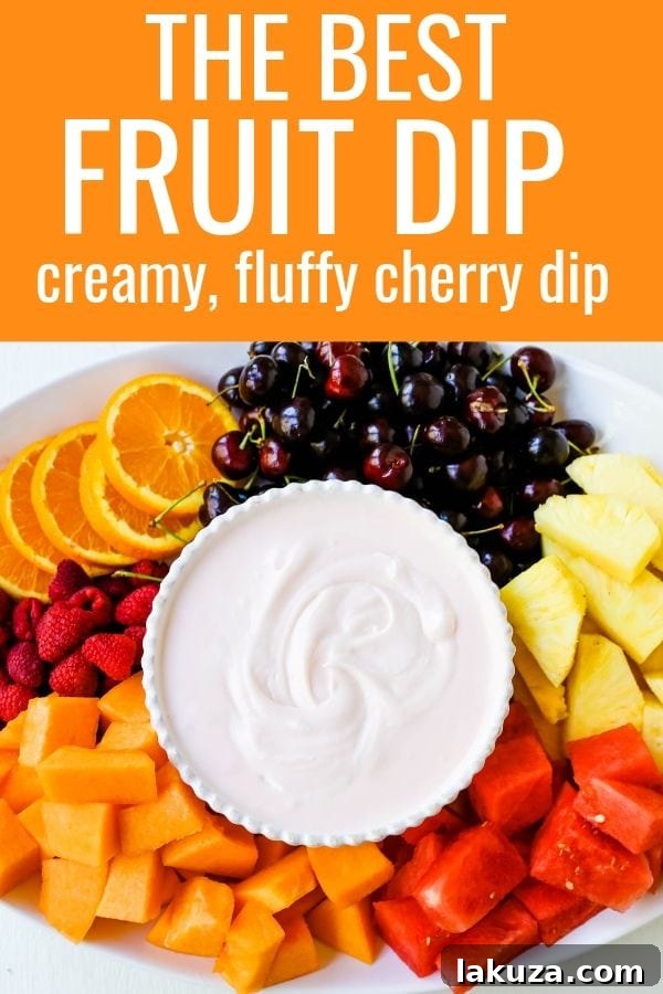 Creamy Fruit Delight 7 A beautifully presented bowl of creamy fruit dip surrounded by a variety of fresh, colorful fruits.