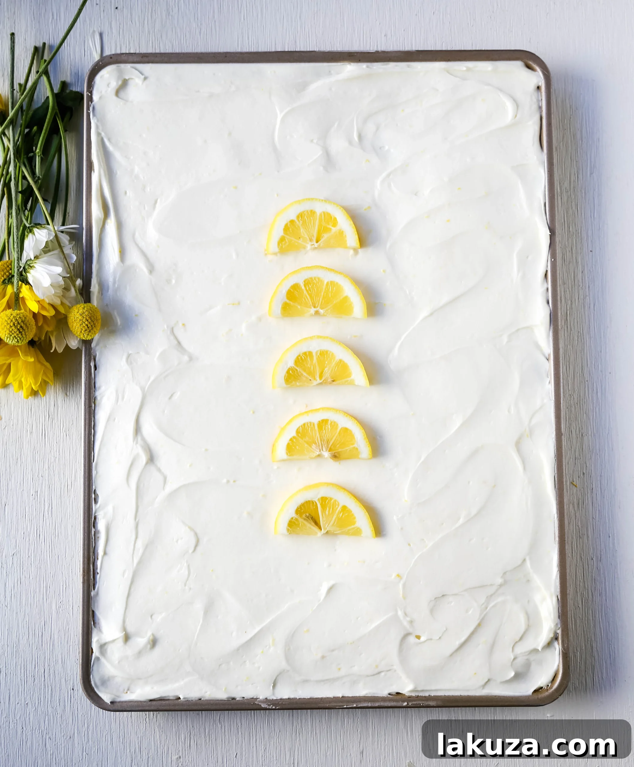Sunshine Lemon Sheet Cake 2 Lemon Sheet Cake Recipe. Moist sour cream lemon sheet cake recipe with a fresh lemon cream cheese frosting. #lemonsheetcake #cake