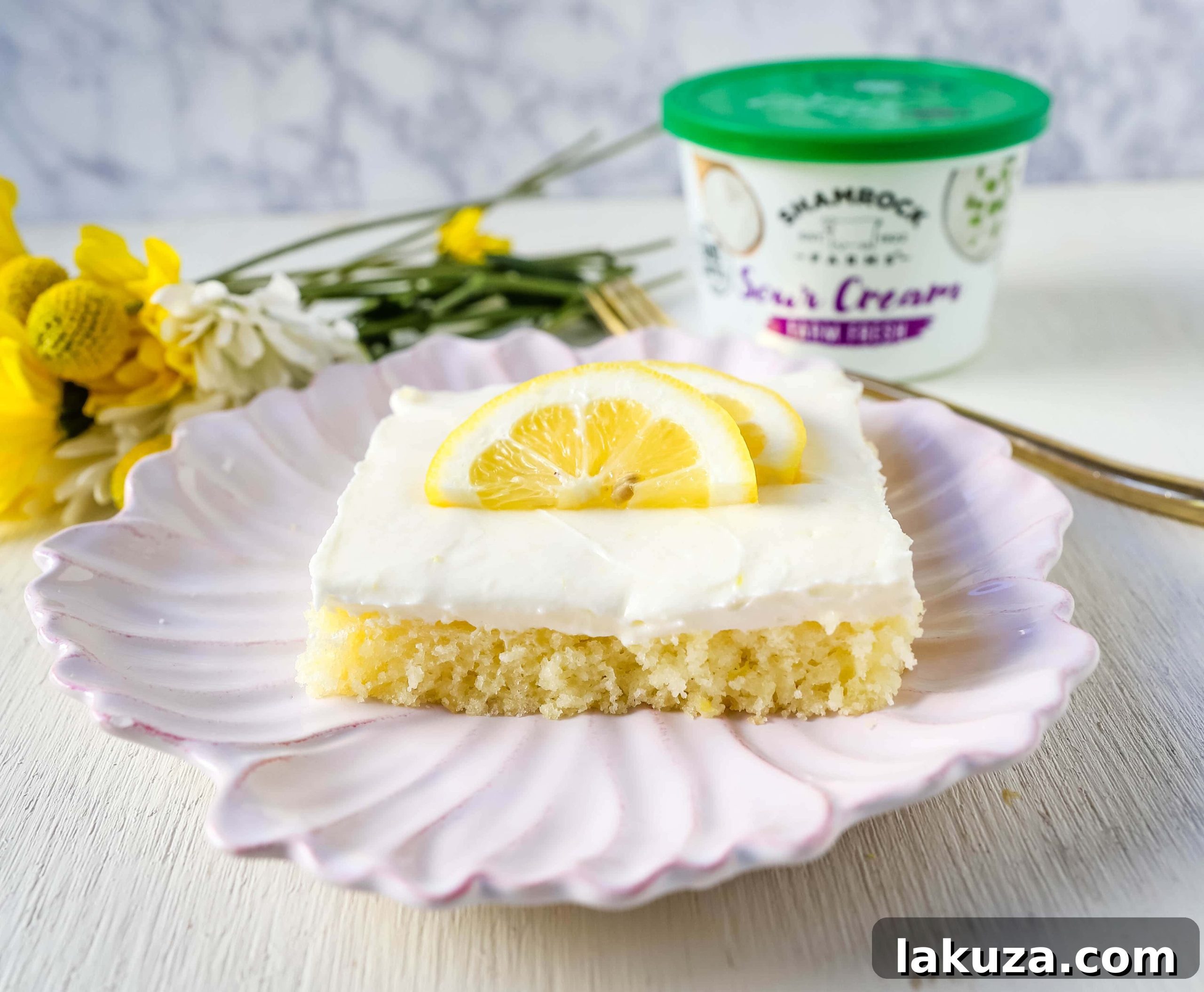 Sunshine Lemon Sheet Cake 4 Lemon Sheet Cake Recipe. Moist sour cream lemon sheet cake recipe with a fresh lemon cream cheese frosting. #lemonsheetcake #cake