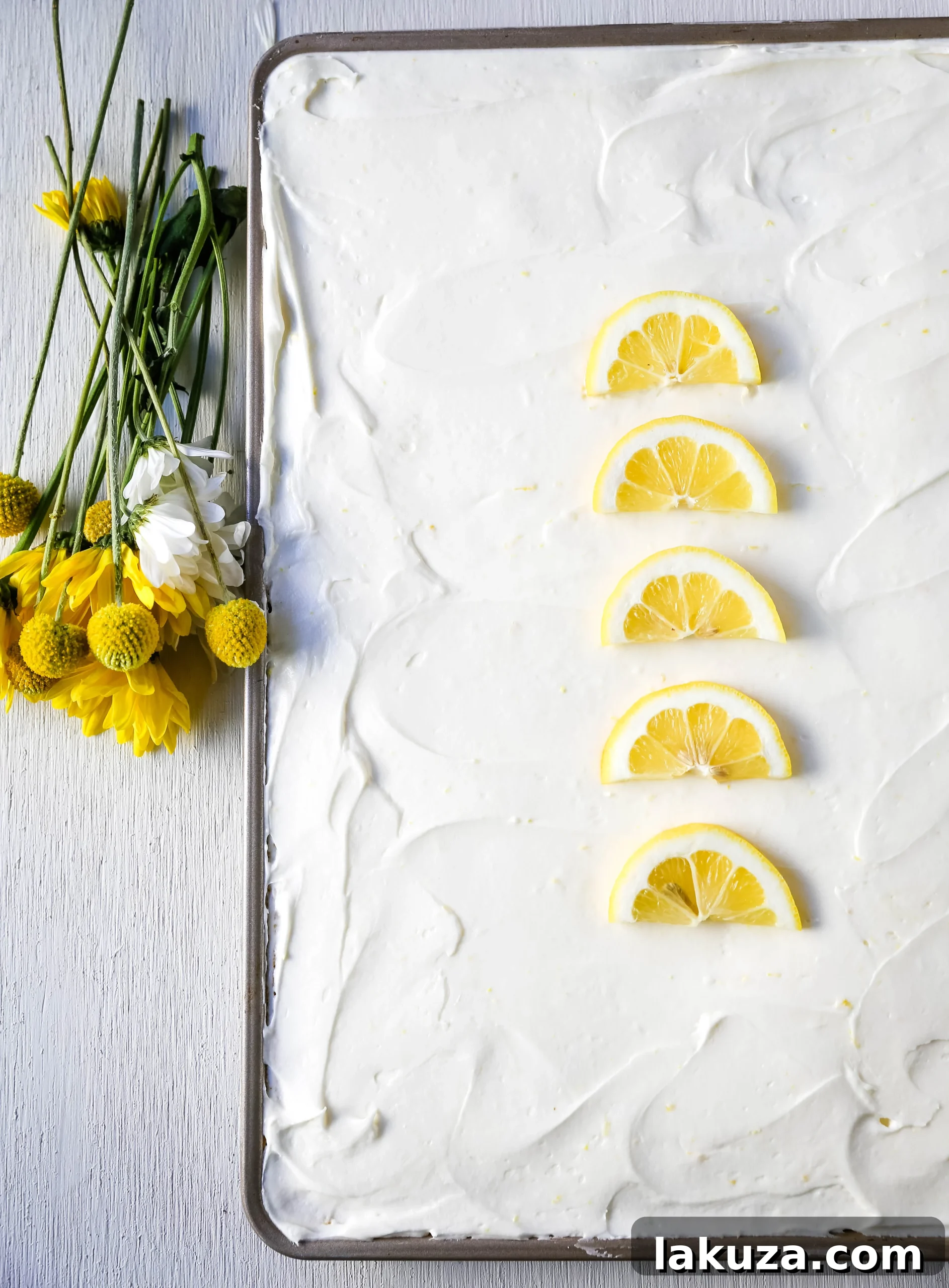 Sunshine Lemon Sheet Cake 5 Lemon Sheet Cake Recipe. Moist sour cream lemon sheet cake recipe with a fresh lemon cream cheese frosting. #lemonsheetcake #cake