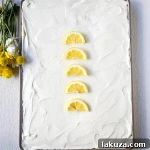 Sunshine Lemon Sheet Cake 9 Lemon Sheet Cake Recipe. Moist sour cream lemon sheet cake recipe with a fresh lemon cream cheese frosting. #lemonsheetcake #cake
