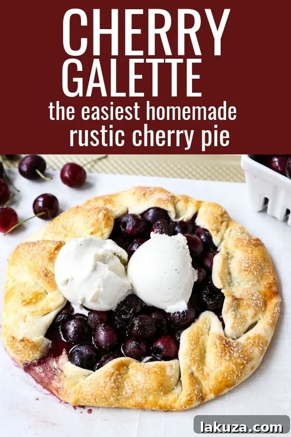 A close-up of a slice of cherry galette with a scoop of melting vanilla ice cream.