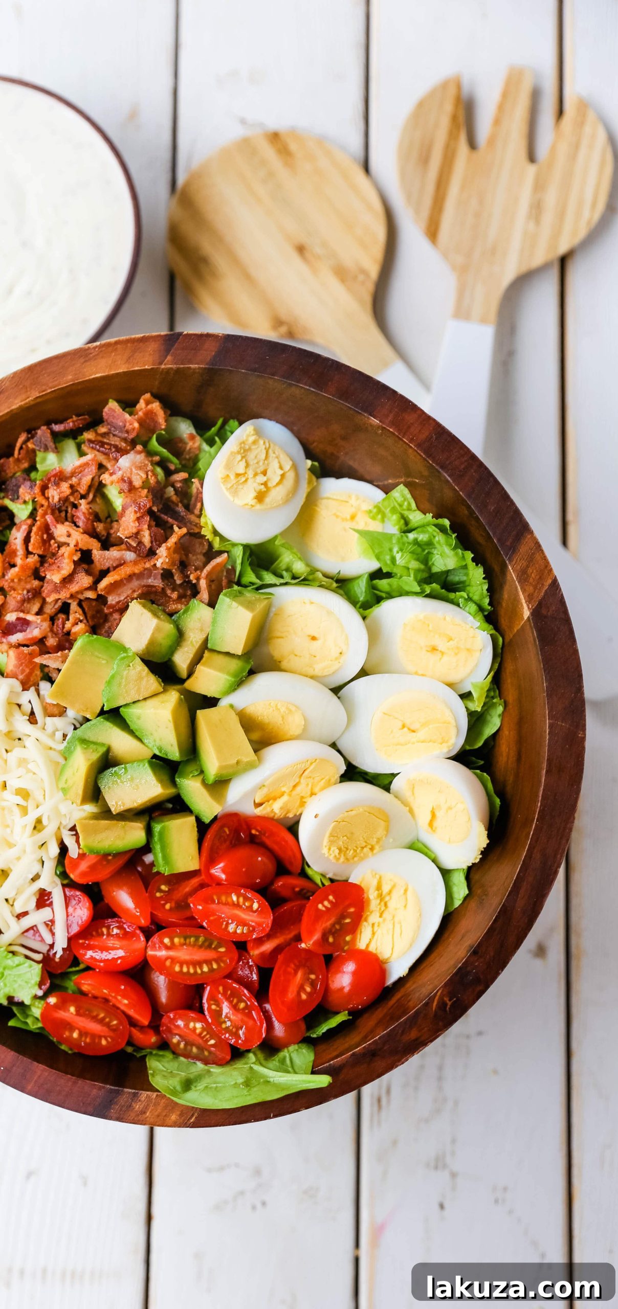 The Quintessential Cobb Salad 3 Cobb Salad ingredients arranged beautifully on a plate